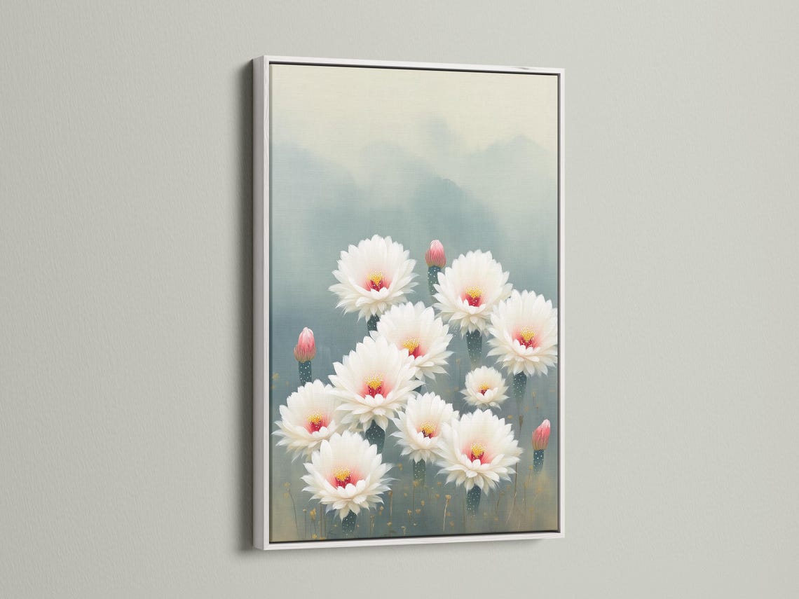 White cactus flowers with pink-red centres and gold specks on a blue-grey background detail view