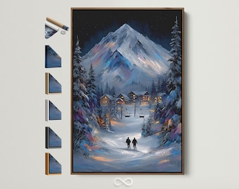 May include: A framed canvas print of a winter landscape featuring a snow-covered mountain and a village. The artwork depicts a snowy path with two figures walking towards the village, with a ski lift visible. The canvas is framed in a brown wooden frame.