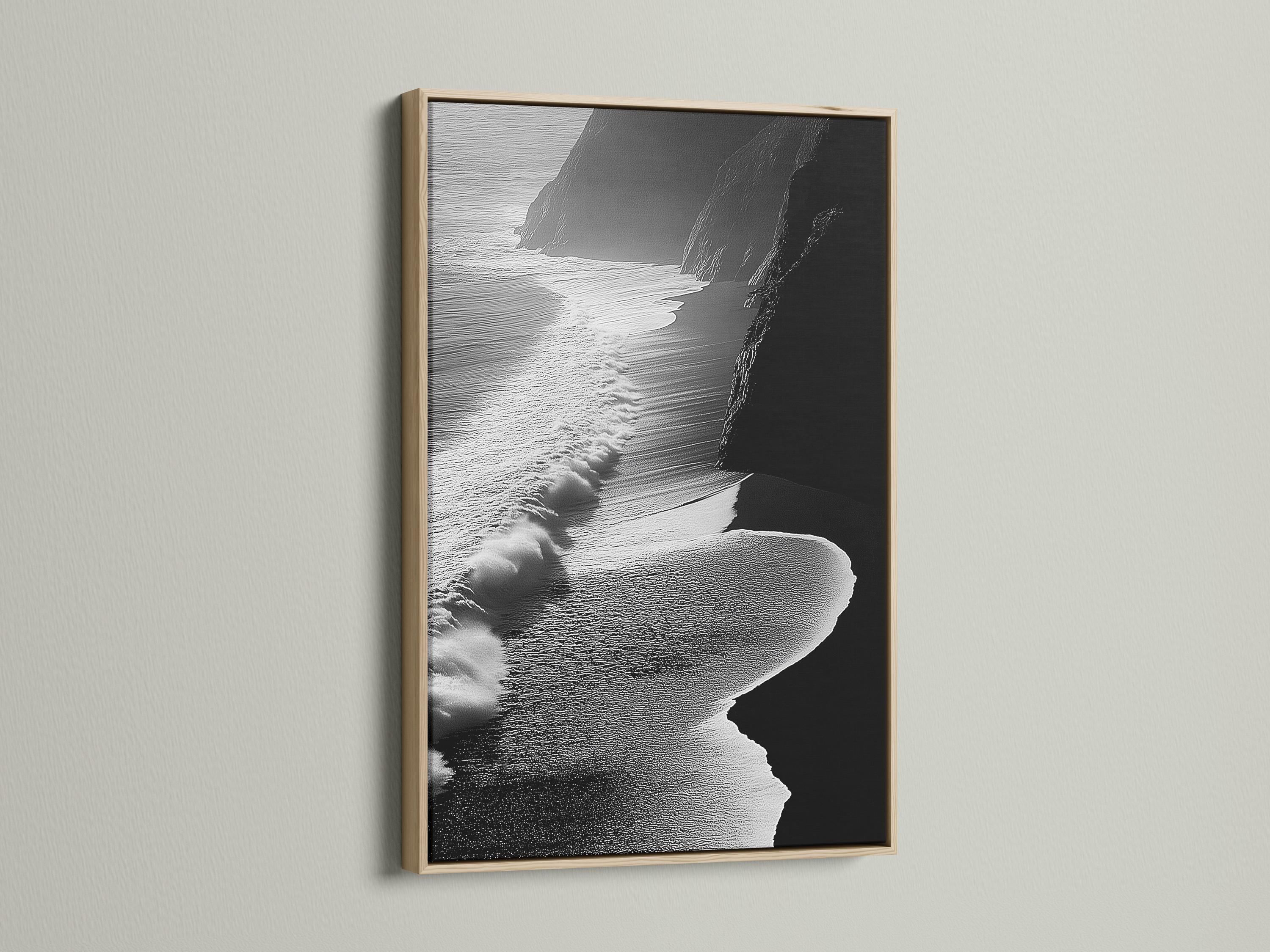 A monochrome seascape shows foamy wave textures breaking along a shoreline, with dark cliff-like shapes framing the scene detail view