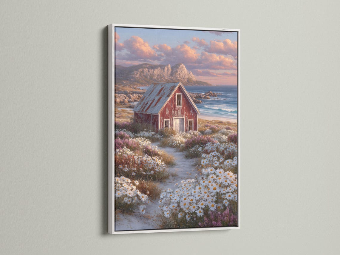 Red barn in a daisy field with ocean and sunset clouds in the background detail view