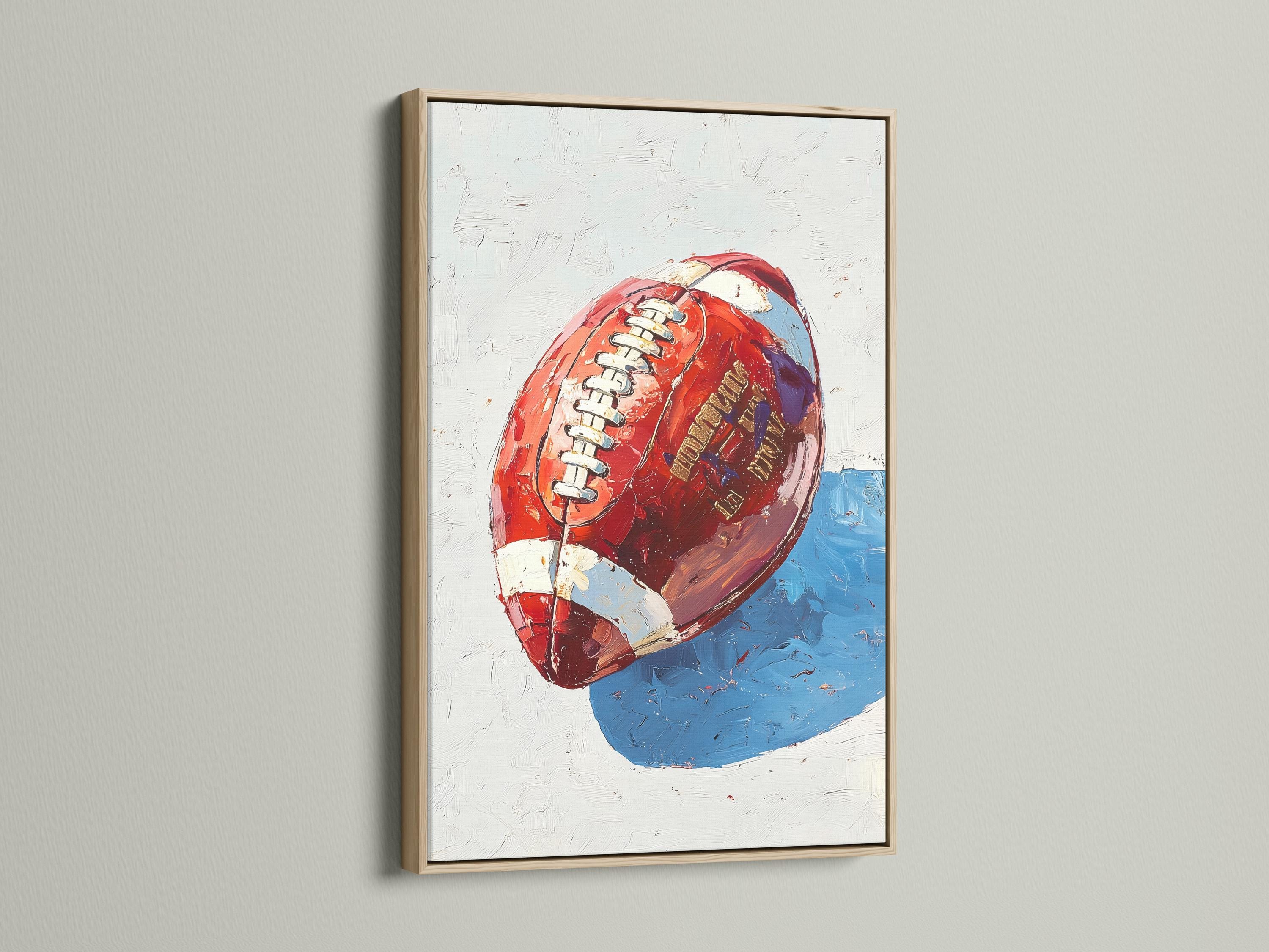 Stylised red and blue football artwork with a helmet-like face and stripe details detail view