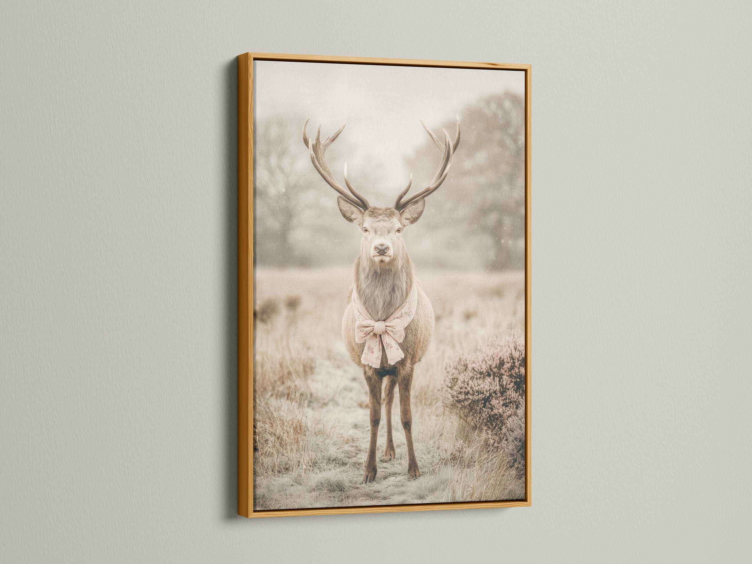 Deer portrait with raised antlers in a misty field, wearing a pale pink bow detail view