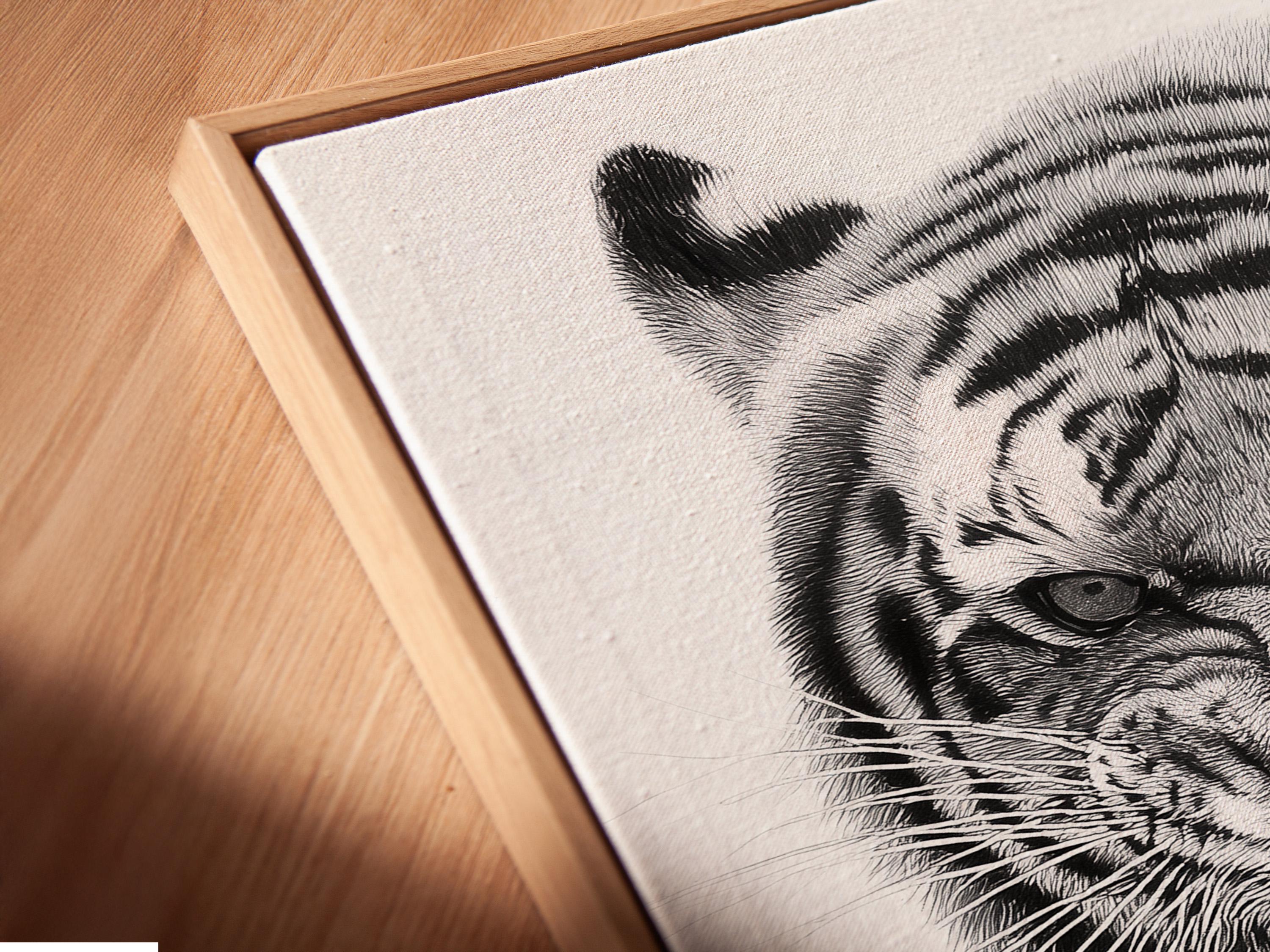 Framed monochrome tiger portrait mockup on a light background with additional display props