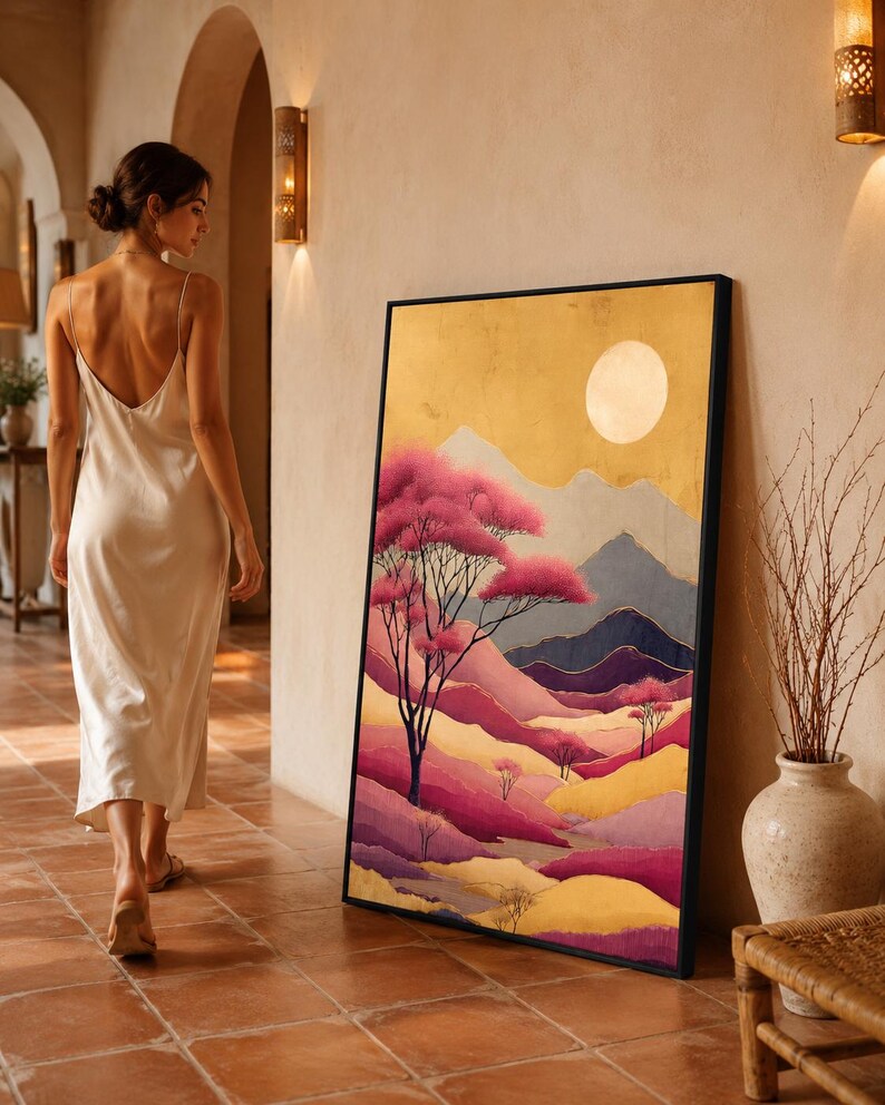 Painterly mountain landscape with blush-pink blossom trees, layered ridges and a pale moon in warm gold tones