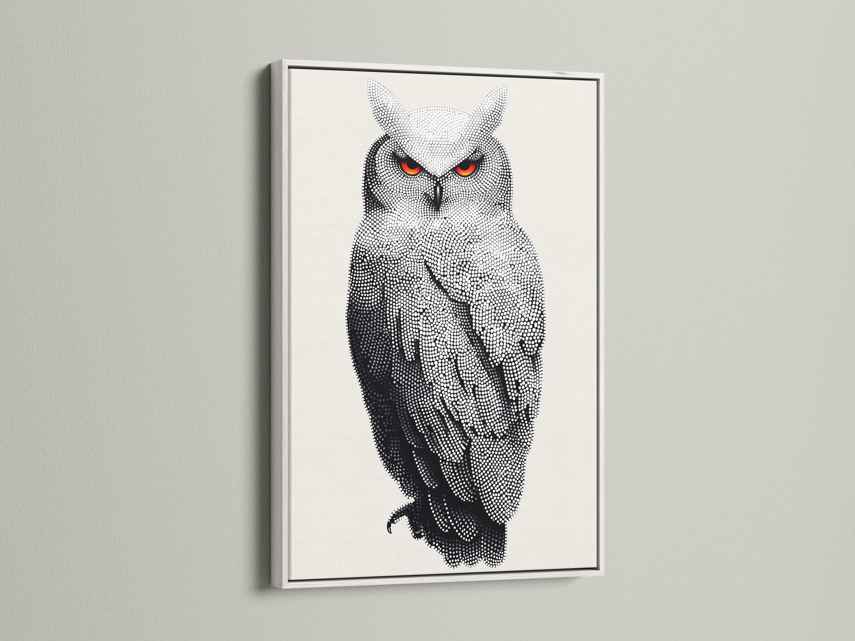 Dotted owl artwork in black and white with bright red-orange eyes detail view