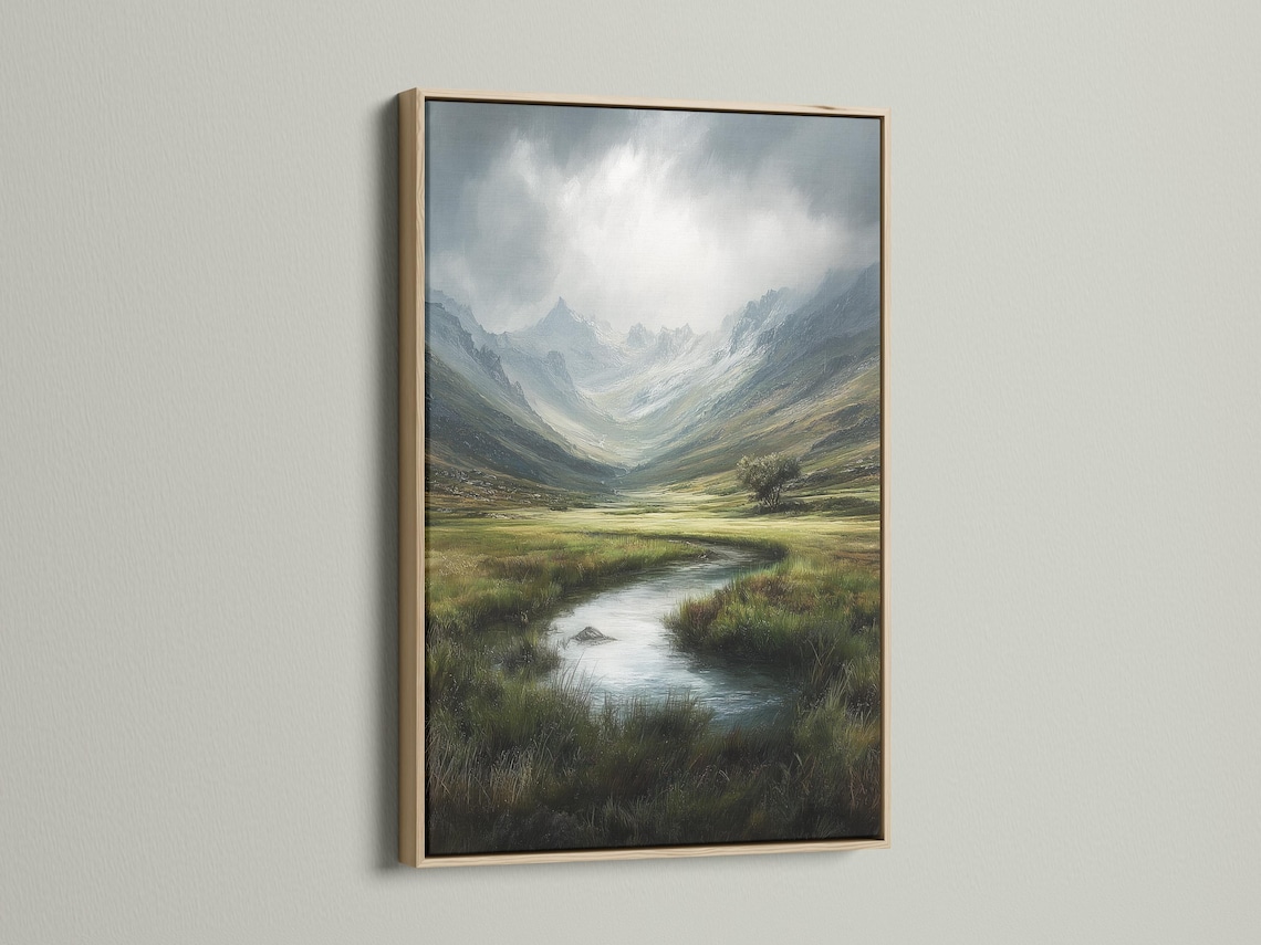 Room mockup showing framed mountain valley landscape artwork