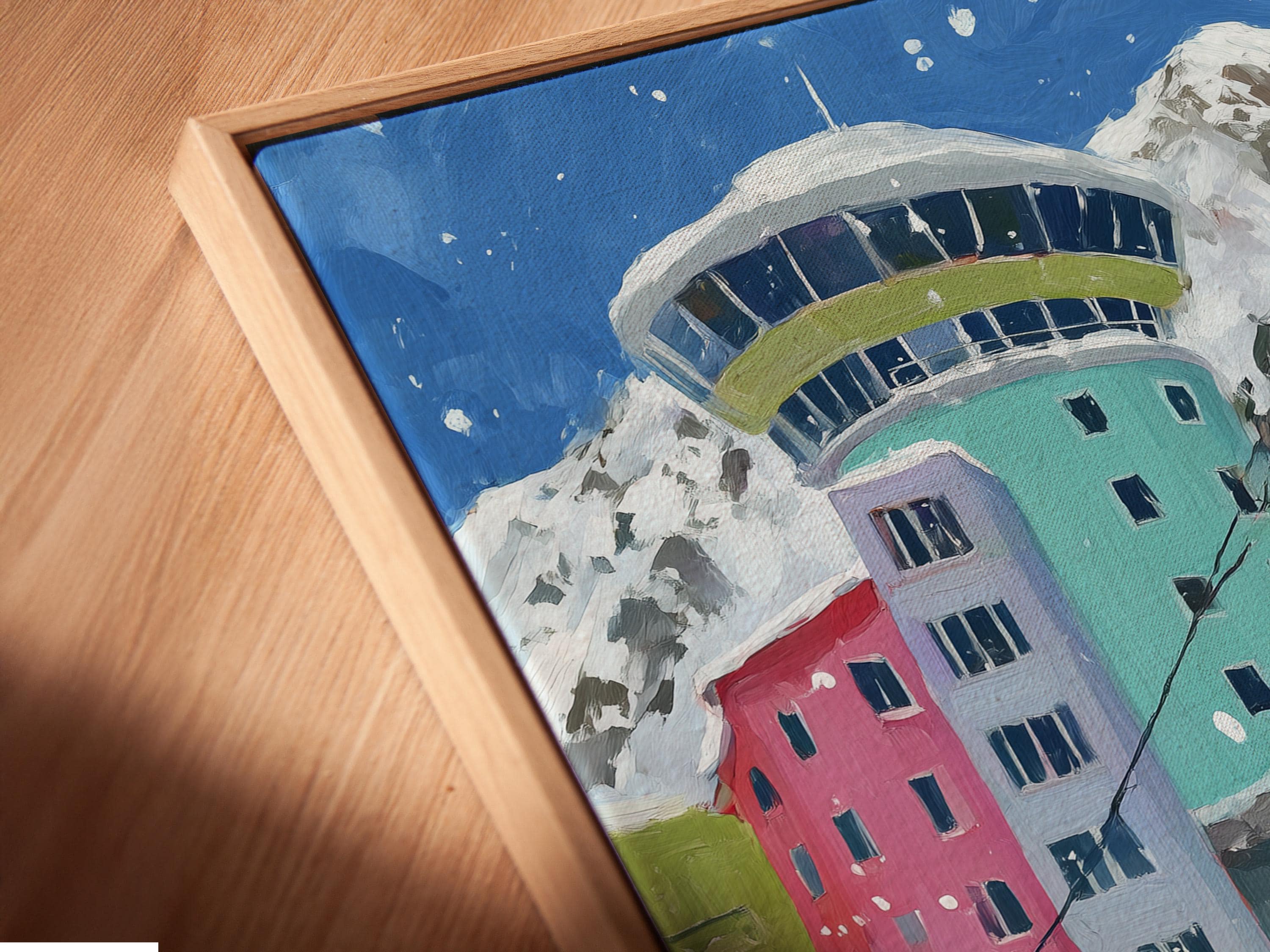 Painterly cable car gondola in a snowy alpine mountain scene with colourful buildings and falling snow detail view