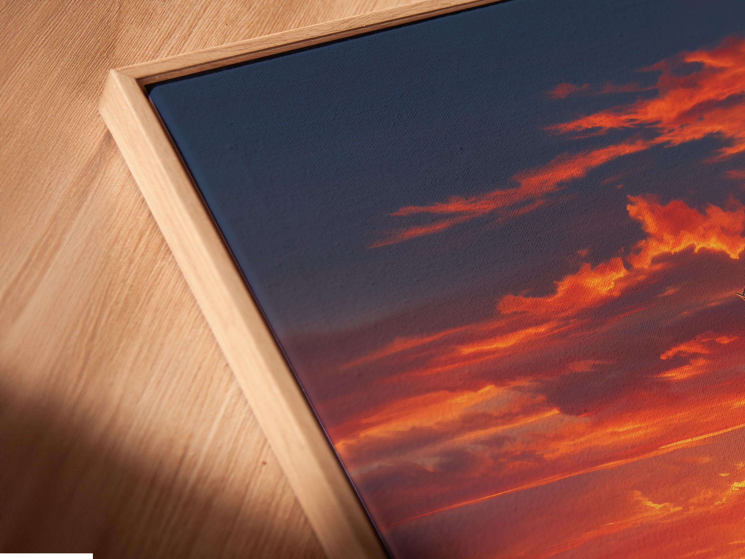 Windmill in a countryside landscape under a glowing sunset sky with hay bales detail view