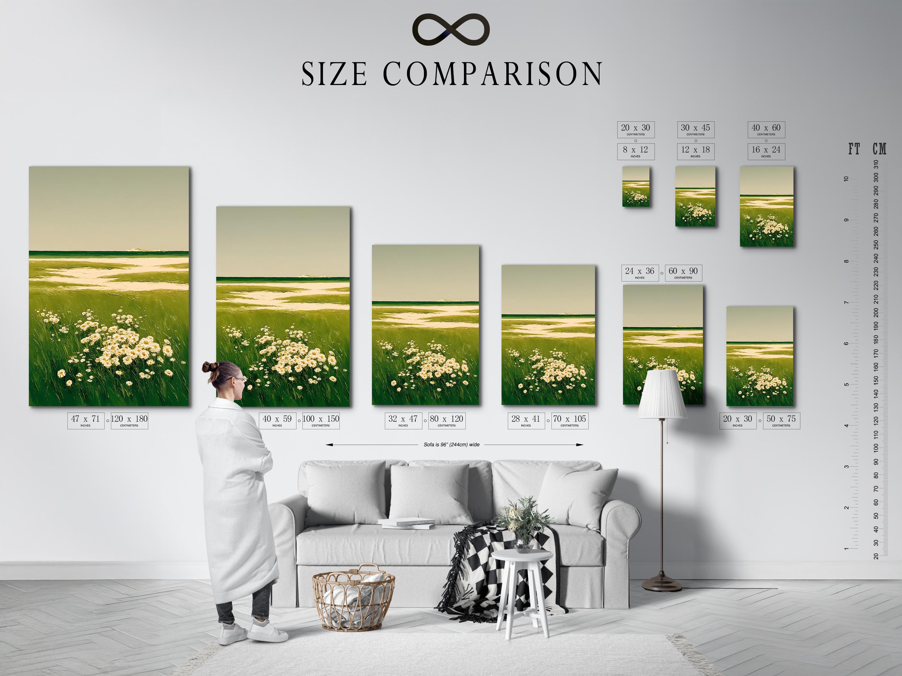 A framed landscape artwork on a light background wall showing green meadow grasses and cream flowers