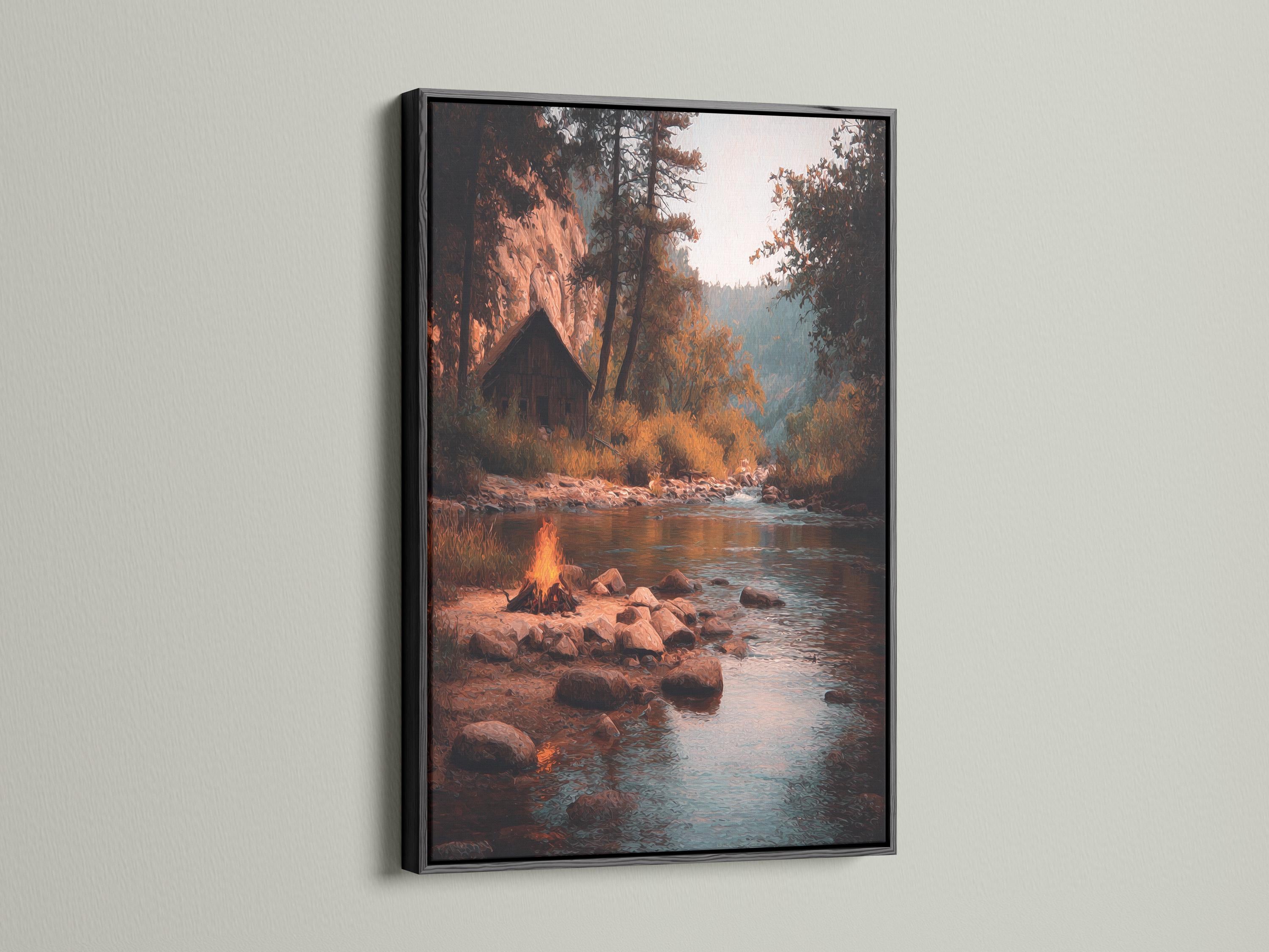 Moody river landscape with a warm campfire glow, rocks, trees and reflections on teal water detail view