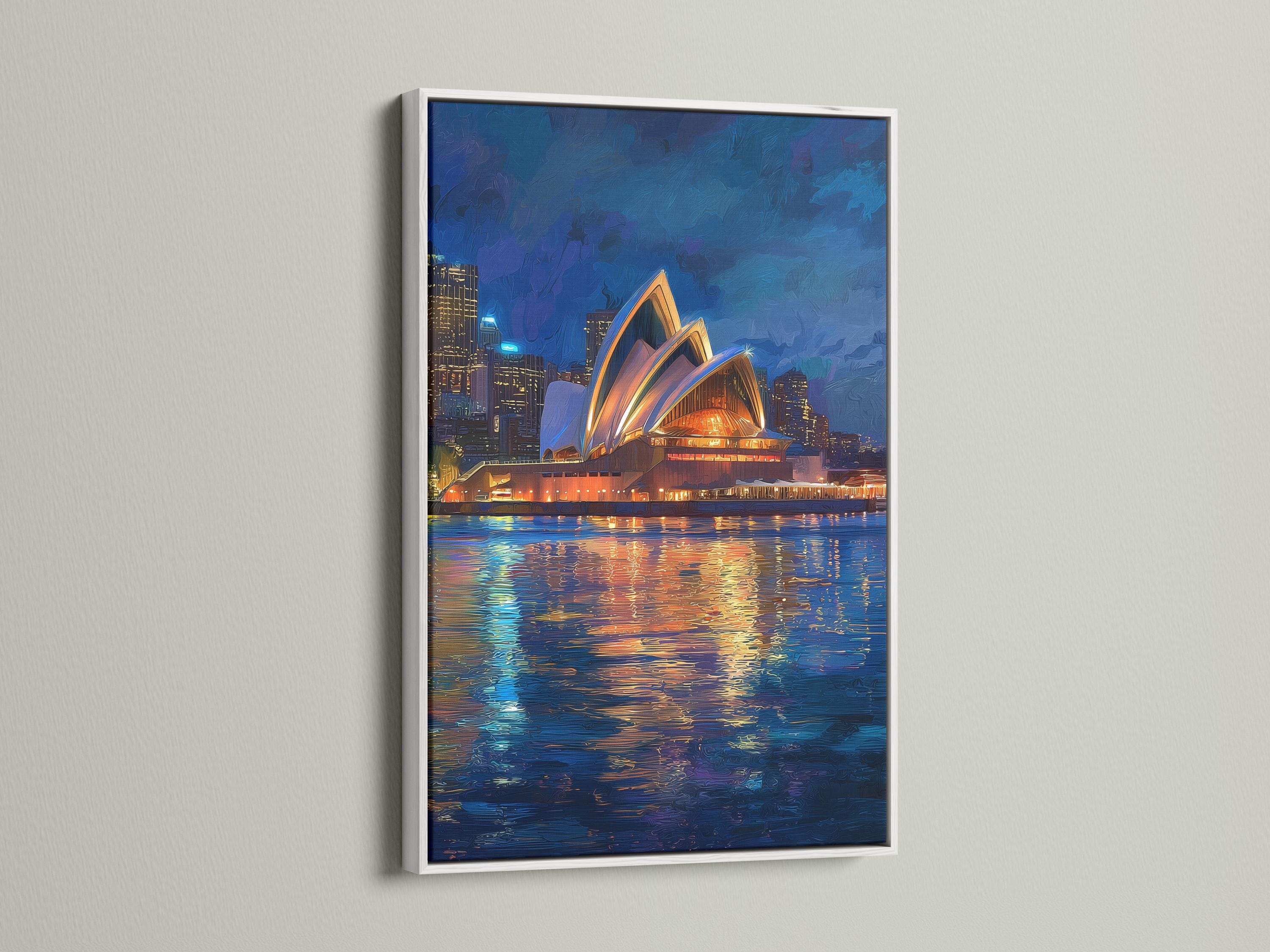 Framed night cityscape artwork featuring a glowing building and reflected lights on water