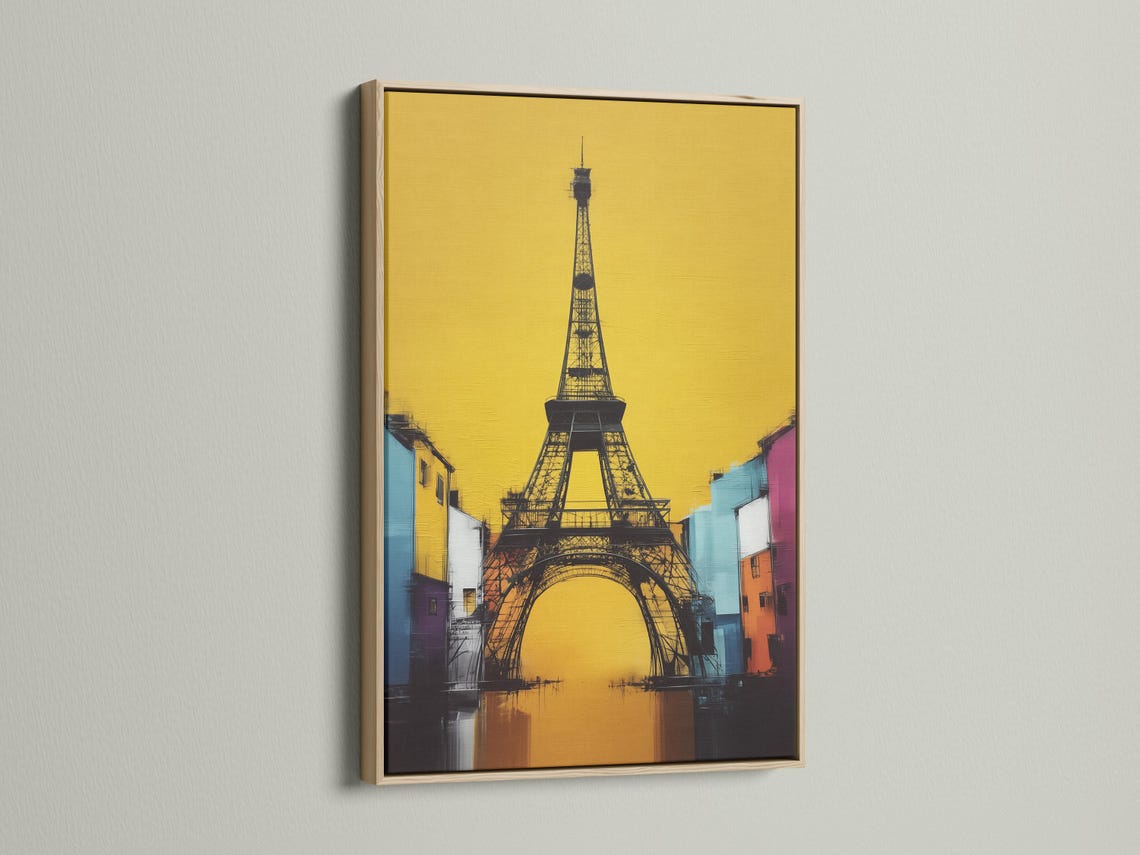 Stylised Eiffel Tower in black with a bright yellow background and colourful city buildings detail view