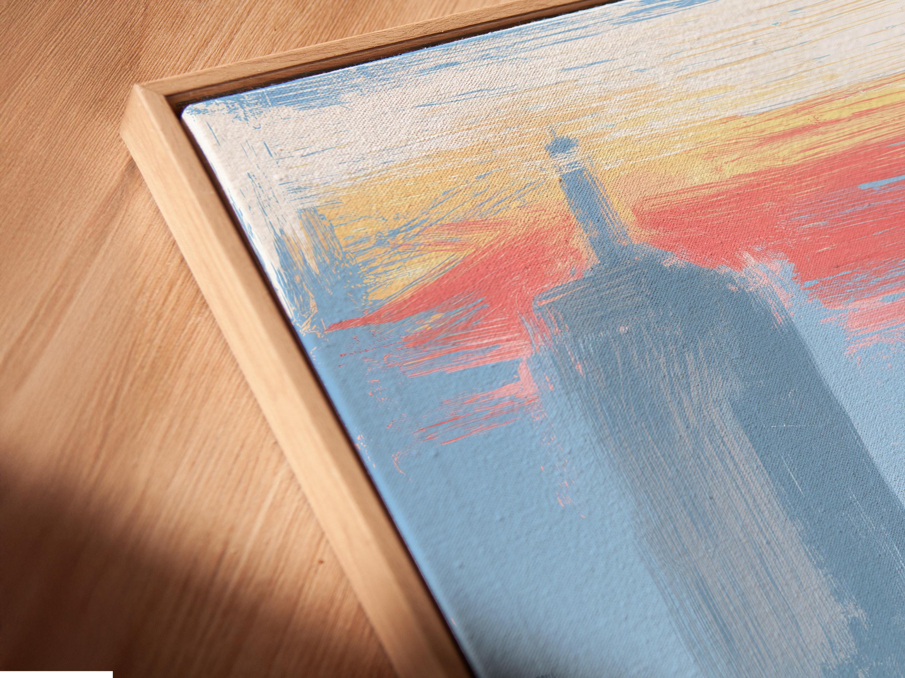 Framed blue city skyline artwork on a wall with a superhero figure and tall tower