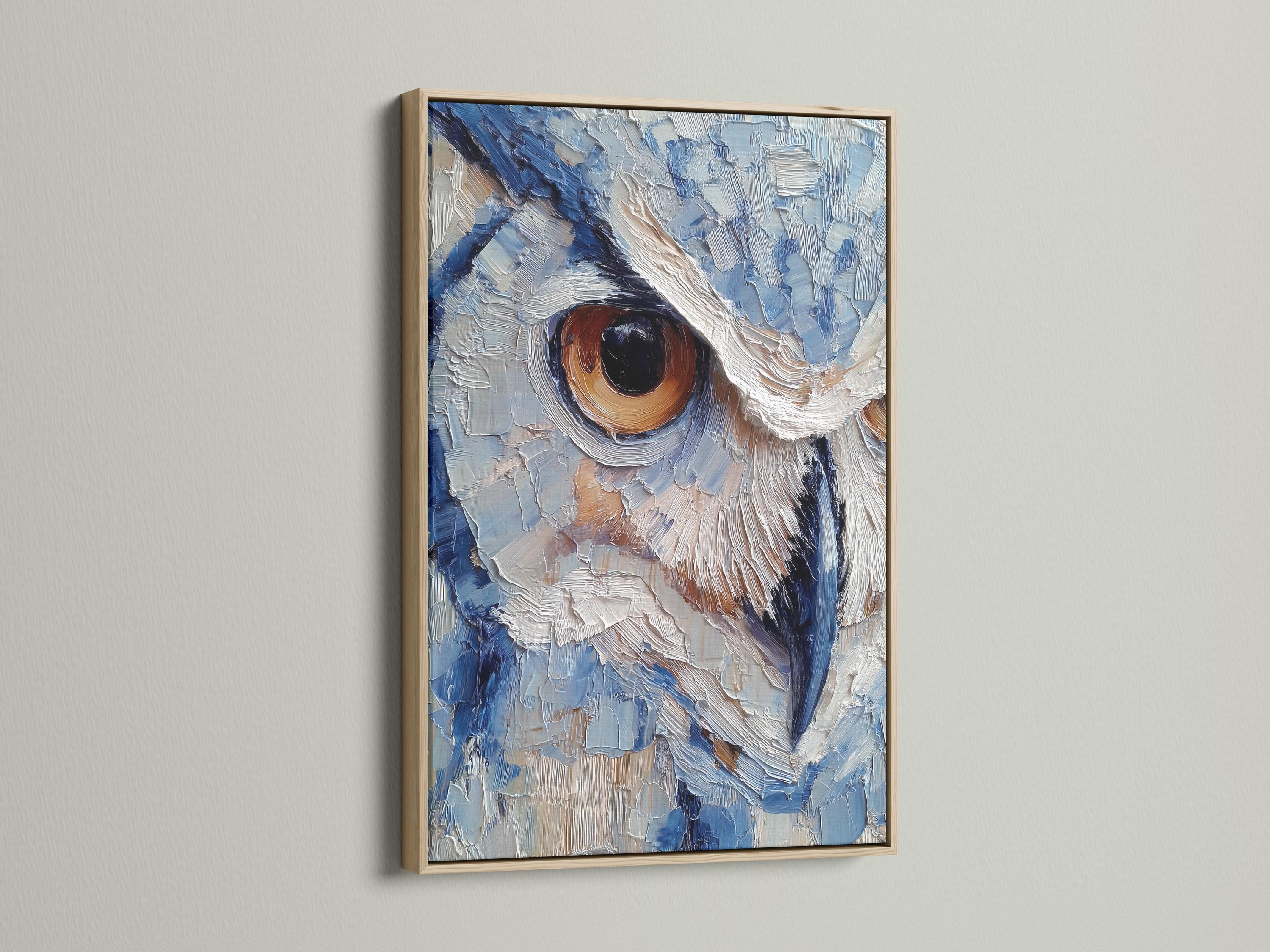Room scene with a framed blue owl painting above a desk where a person writes in a book