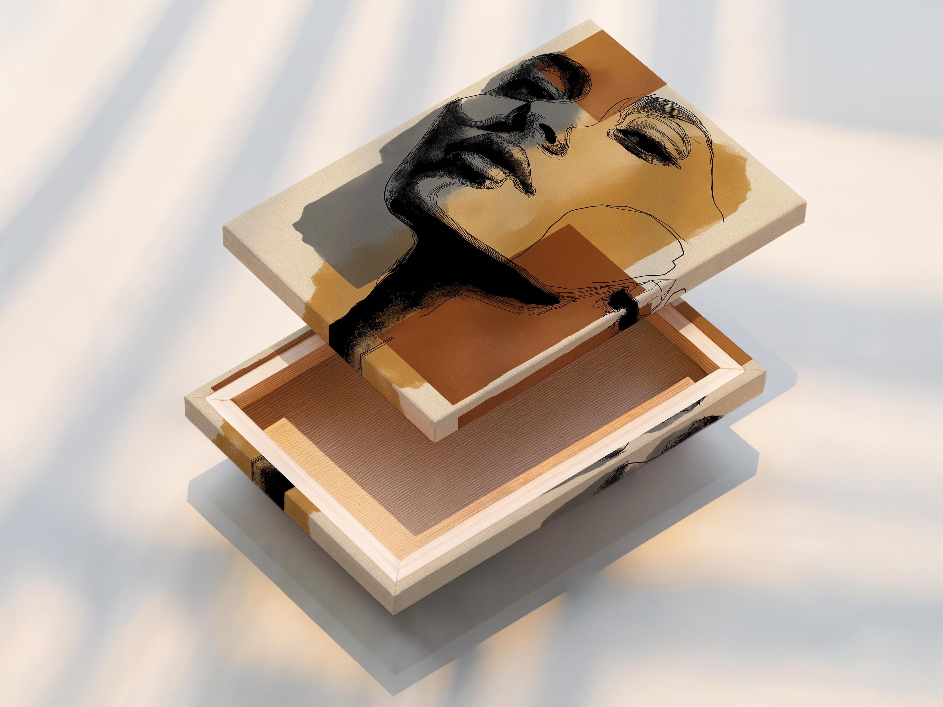 Room mockup showing a framed minimalist abstract face artwork with neutral earth-tone blocks