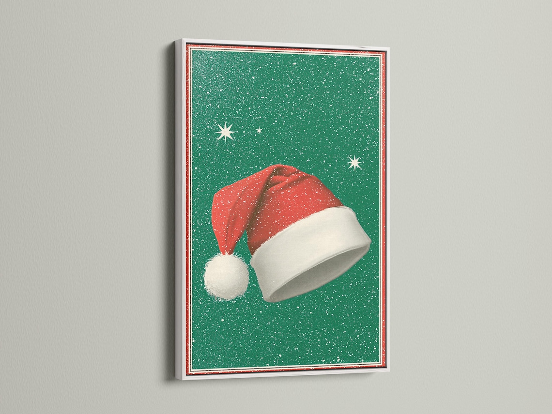 Room mockup featuring a framed Santa hat artwork on an emerald green speckled background