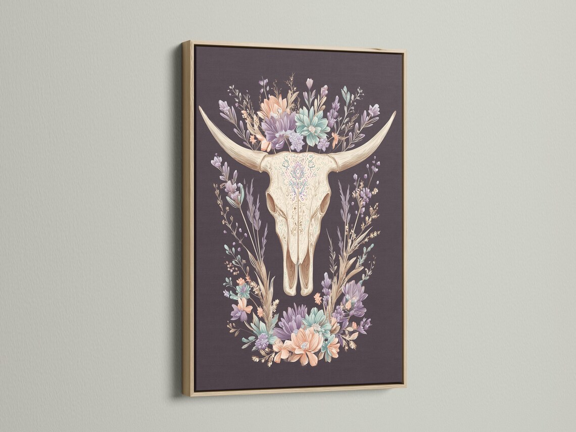 Bull skull illustration surrounded by a wreath of pastel wildflowers on a dark mauve background detail view