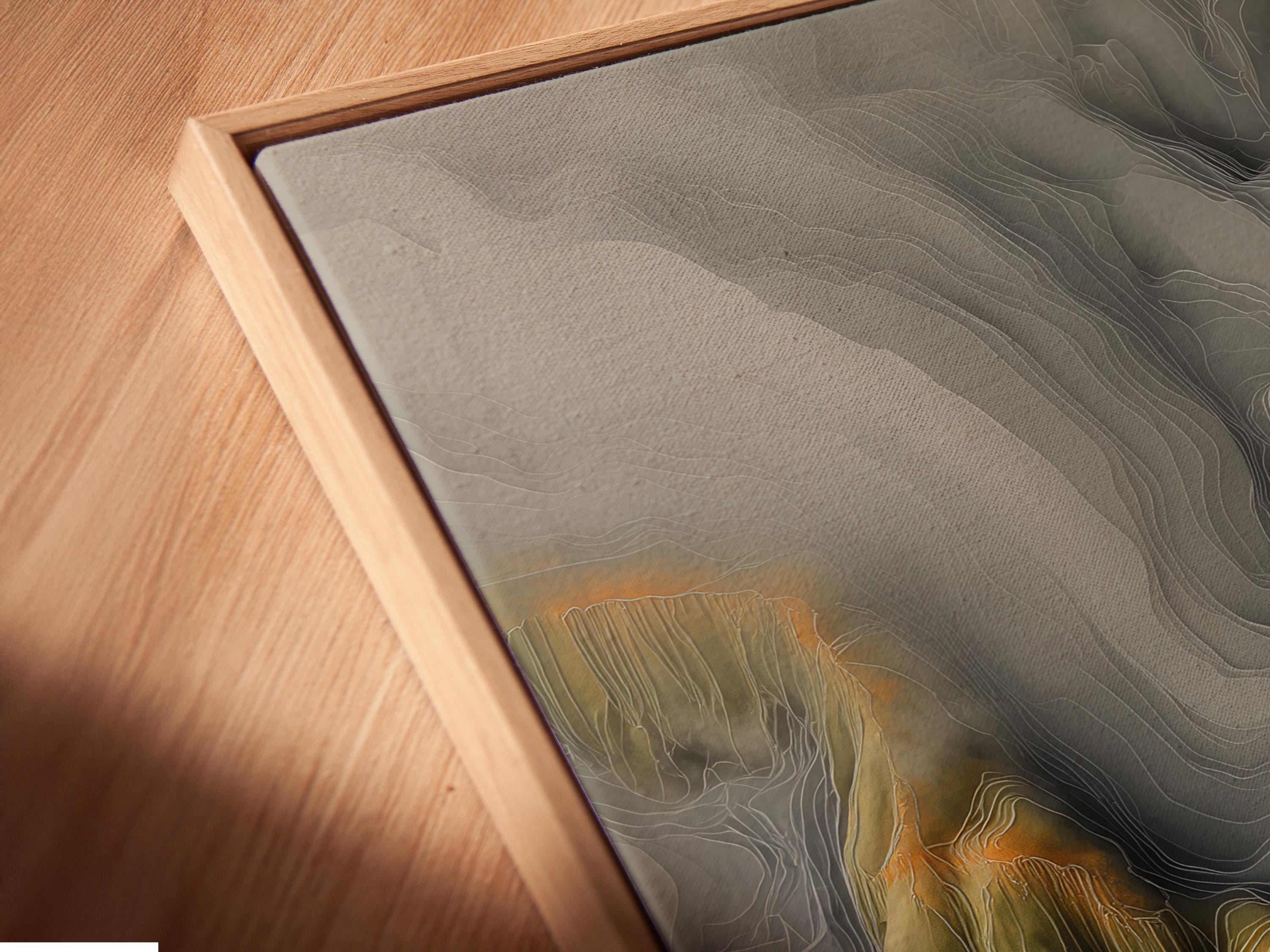 Portrait framed abstract mountainscape artwork in grey and olive green with warm amber accents
