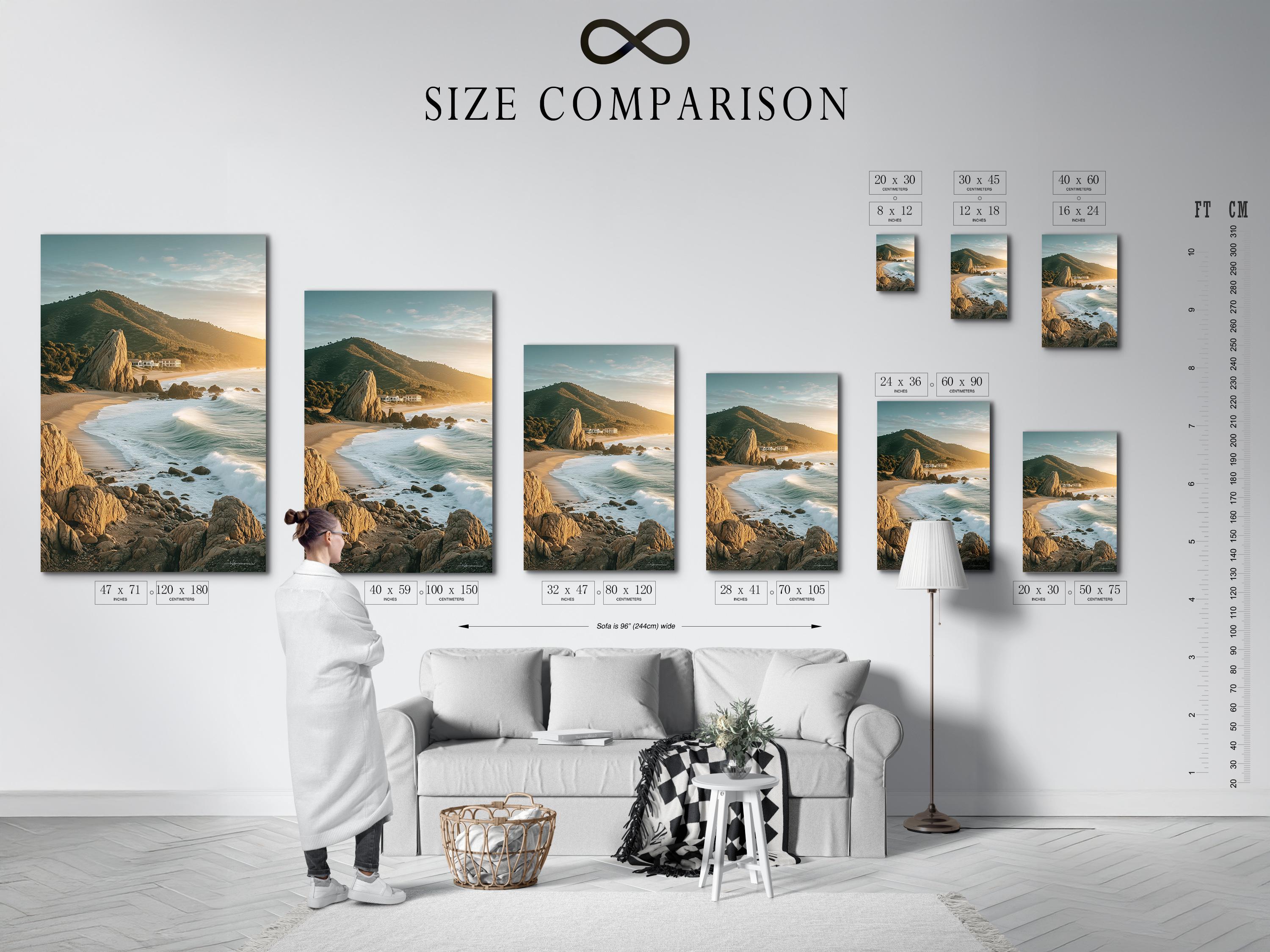 Golden hour seascape showing sandy shore, foamy waves, rocky cliffs and headland detail view