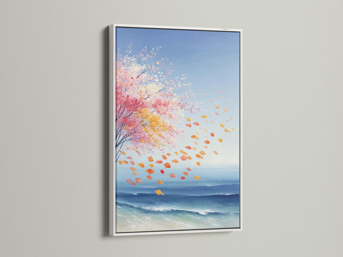 Room mockup showing a framed coastal seascape artwork with pink blossom petals and blue ocean