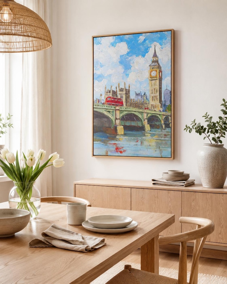 Painterly blue cityscape with a tall clock tower and arched bridge spans over water
