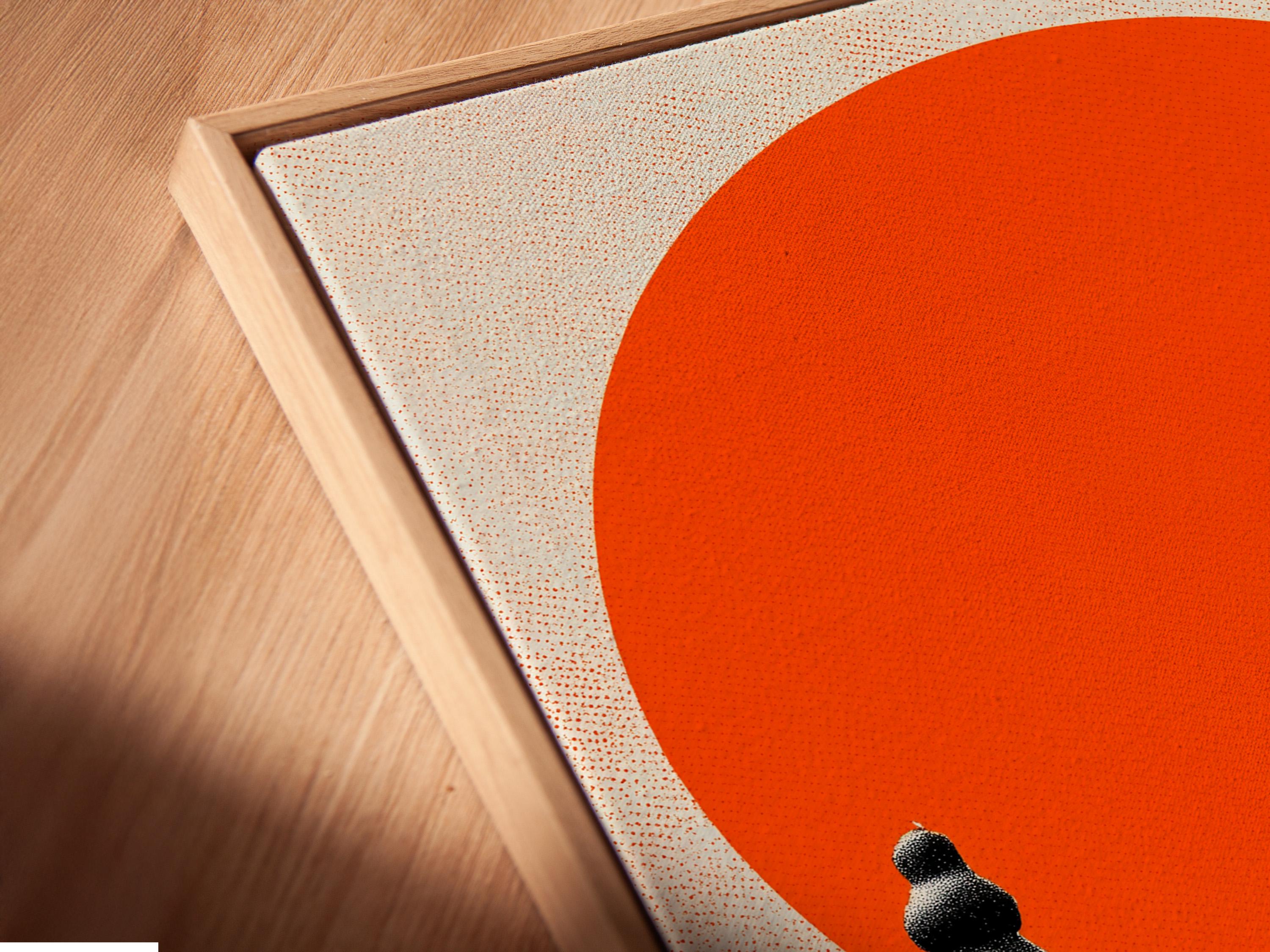 Chess canvas wall art in a frame, showing black pieces on a checkered floor with an orange circle backdrop
