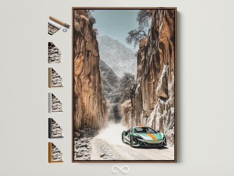 Green sports car on a sandy path in a rocky desert canyon with misty mountains