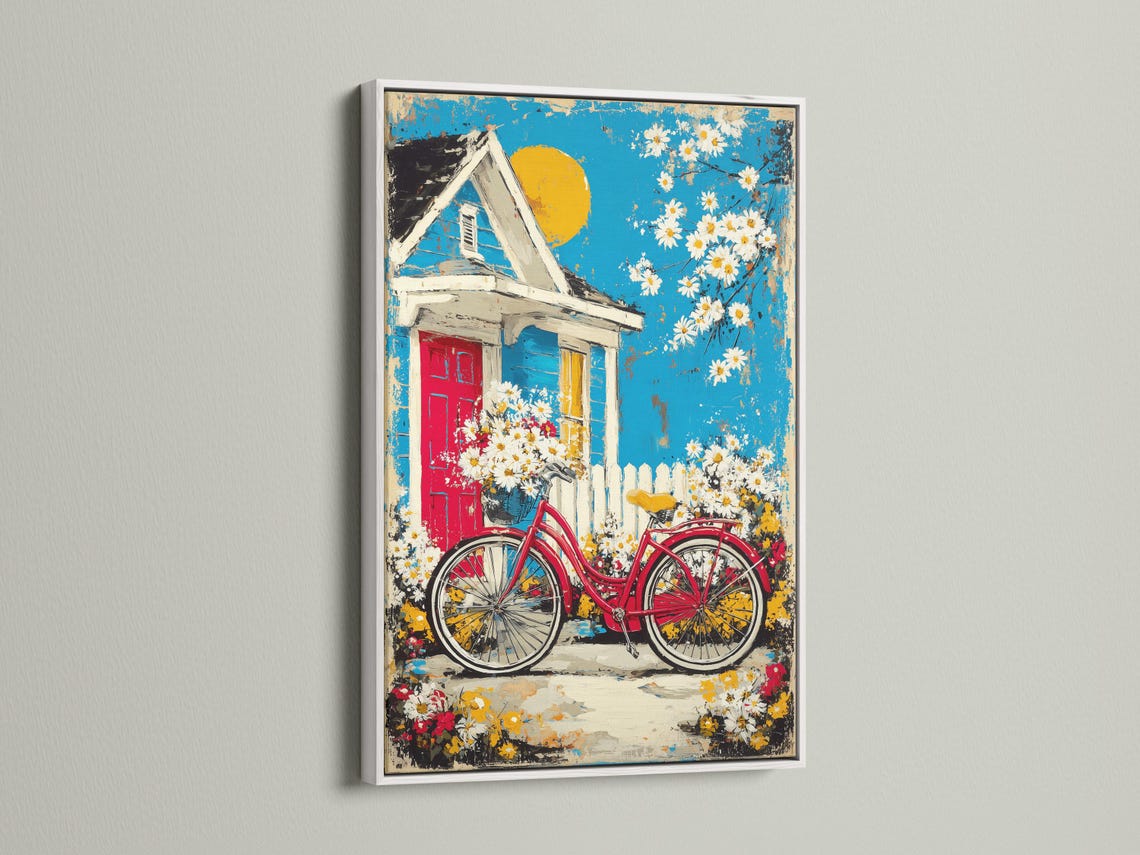 Red bicycle and daisies in front of a cottage house under a bright blue sky detail view