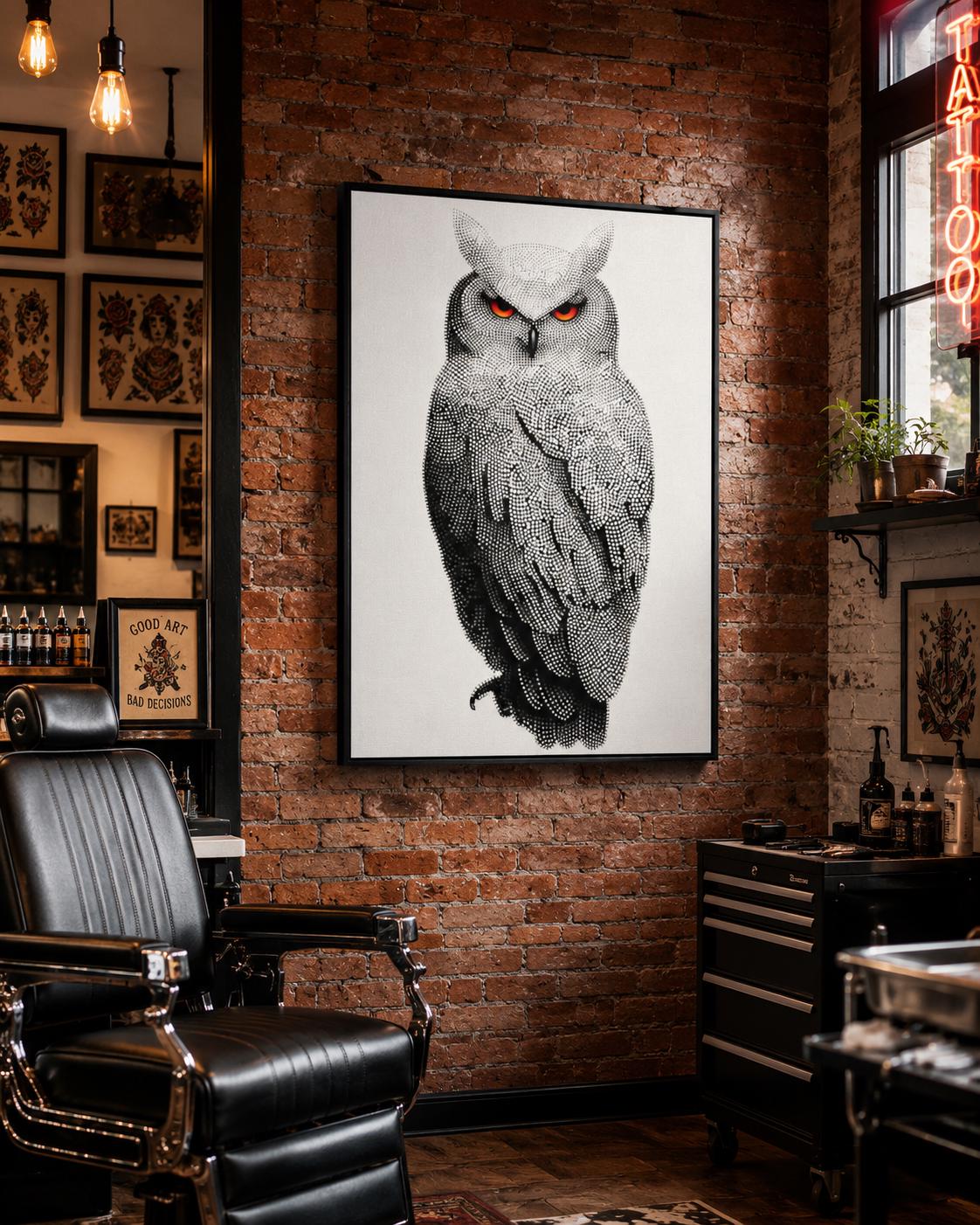 Dotted owl artwork in black and white with bright red-orange eyes detail view