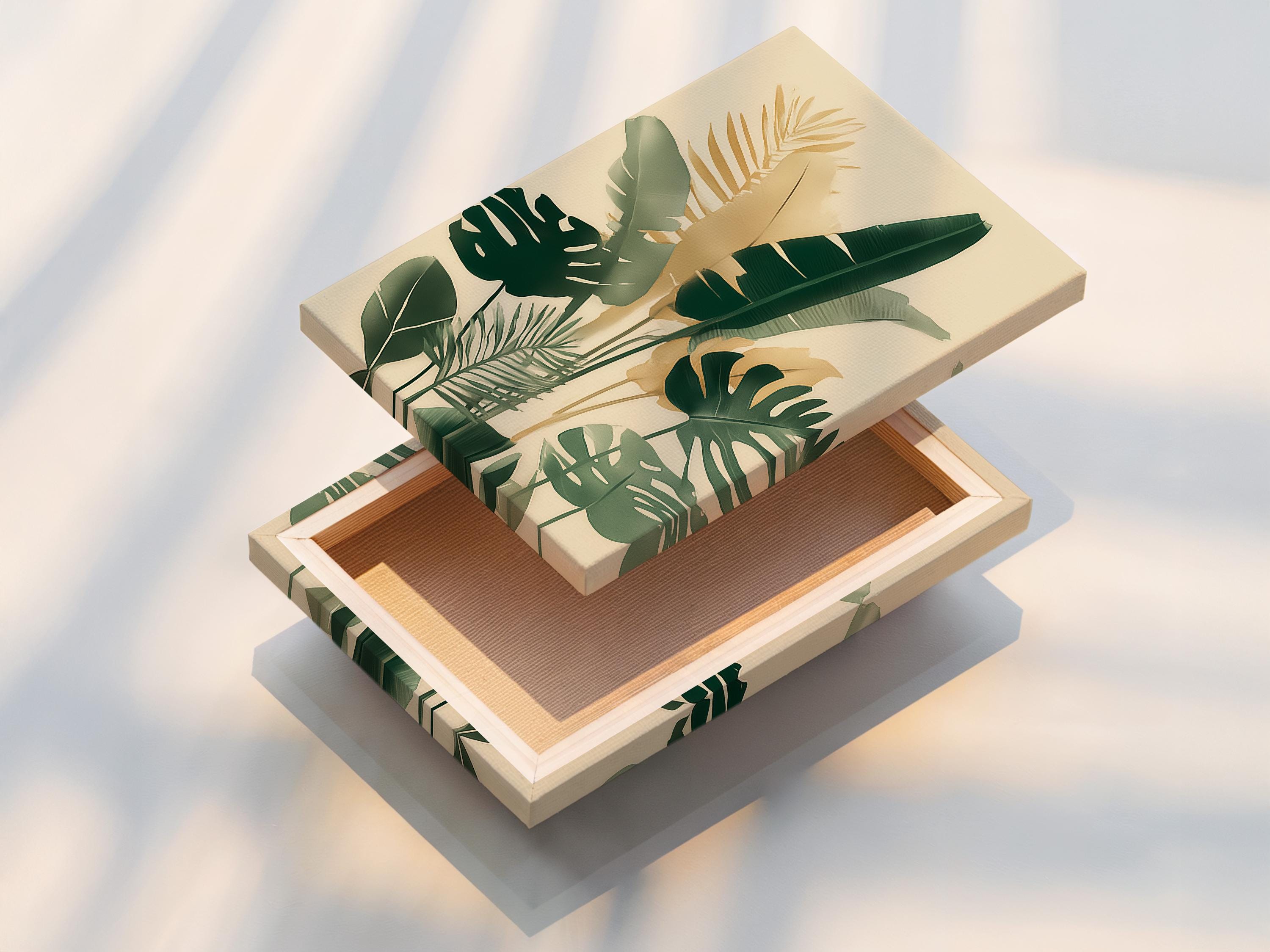 Room mockup showing framed botanical artwork with tropical leaves in cream and green