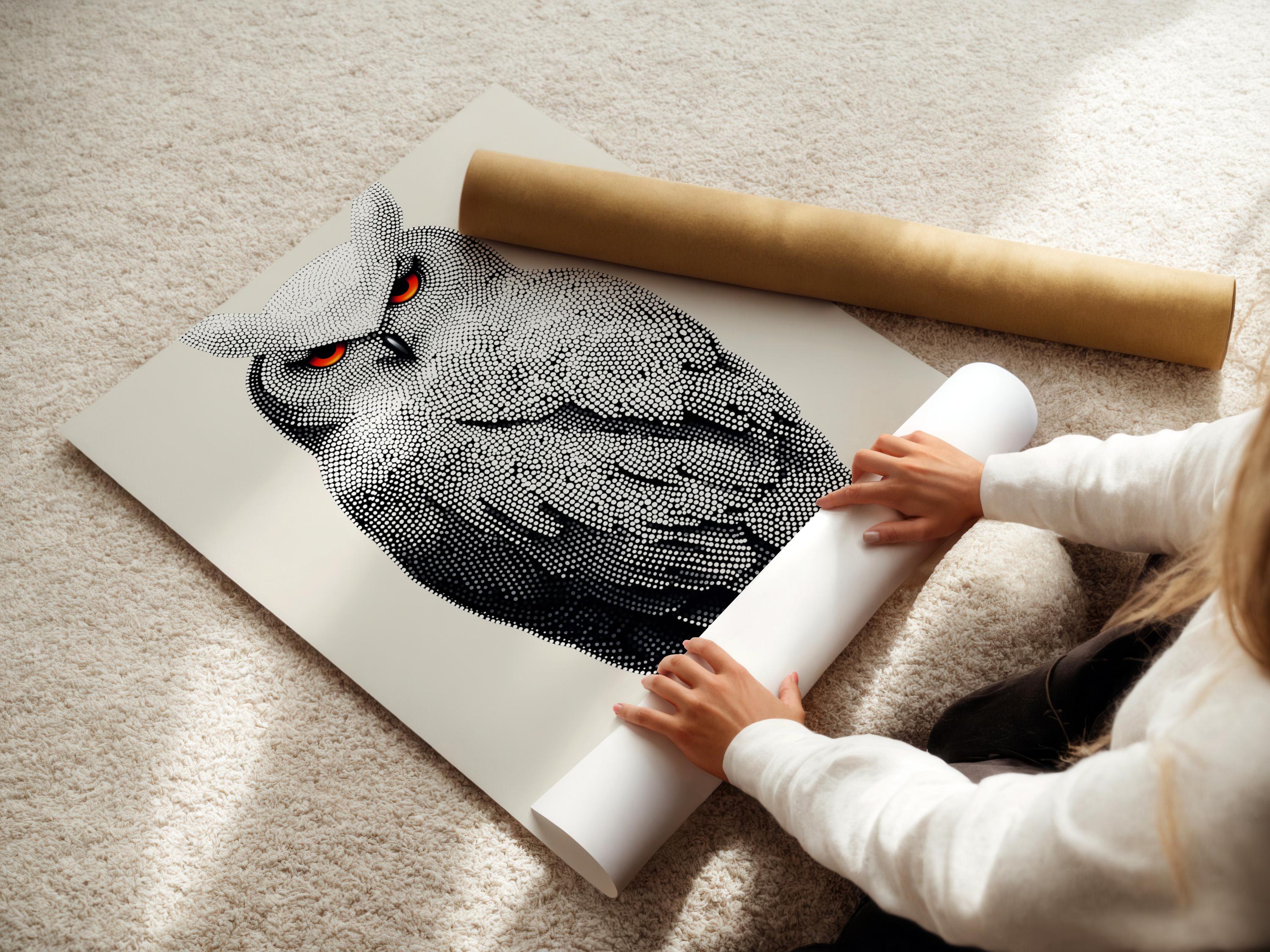 Dotted owl artwork in black and white with bright red-orange eyes detail view