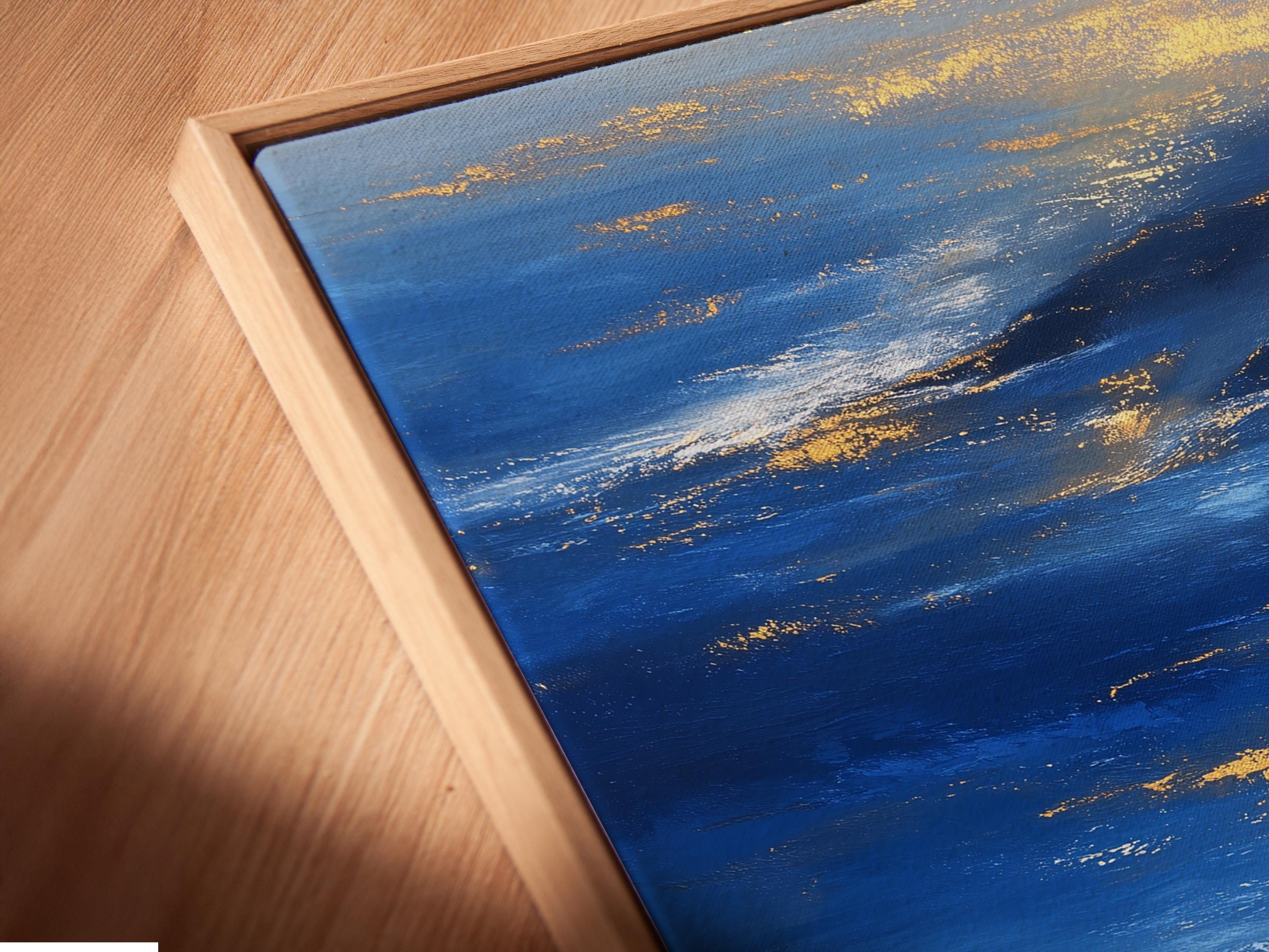 Blue and gold seascape artwork with layered ocean waves, a solitary figure, and a reflection detail view