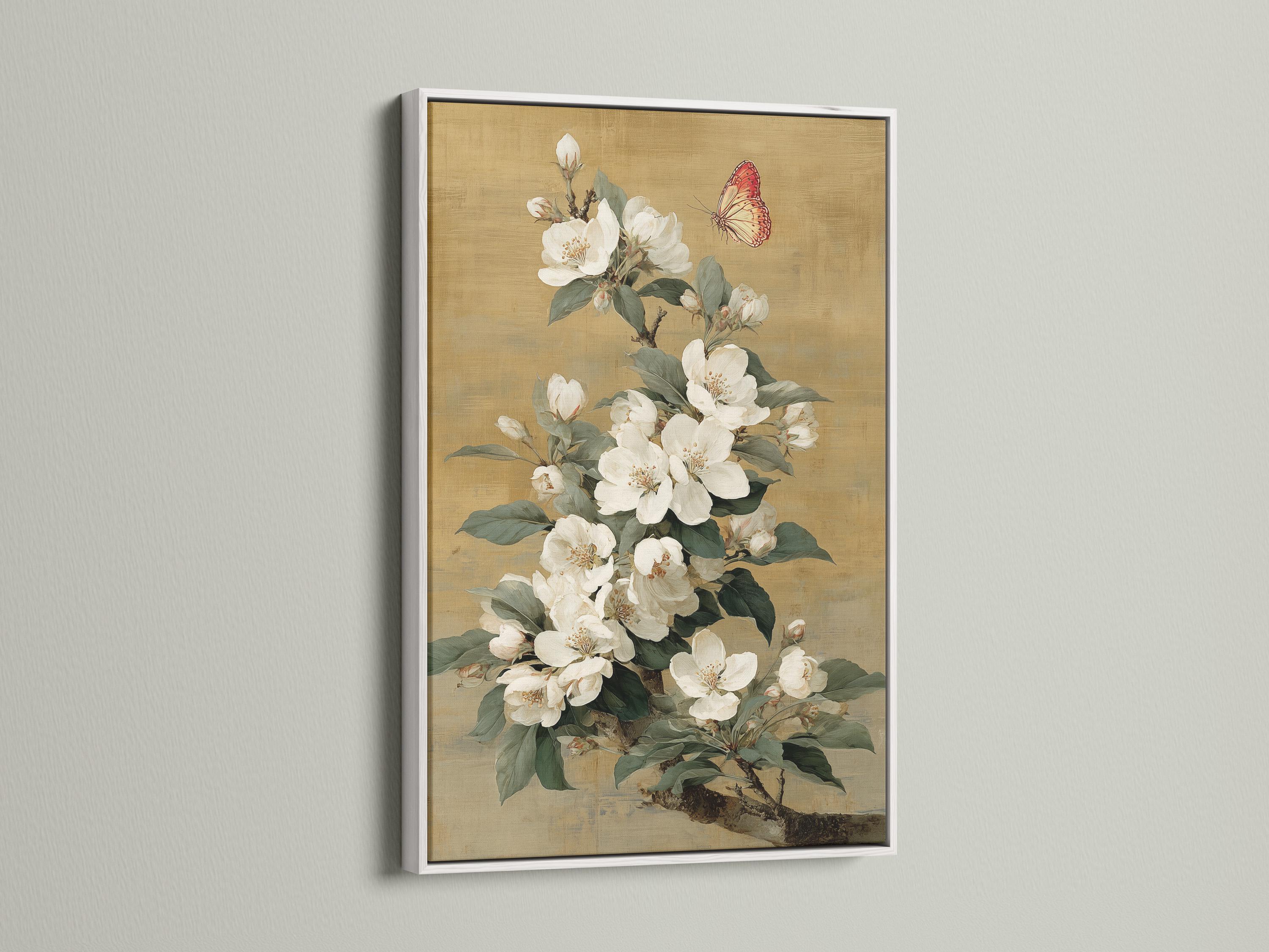Vertical framed artwork mockup on a light wall with a bouquet of white blossoms and a butterfly
