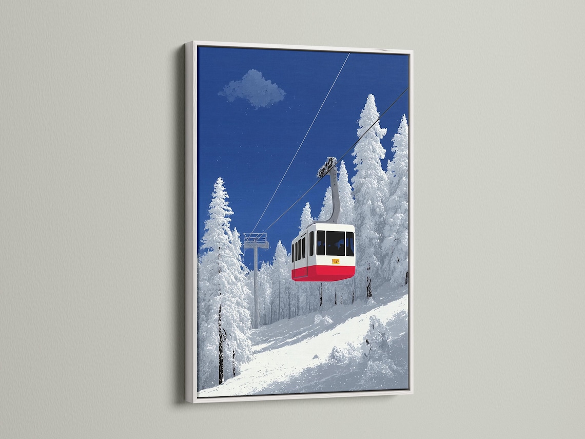 Snowy mountain cable car scene with diagonal cables, deep blue sky, pine trees and a red gondola detail view