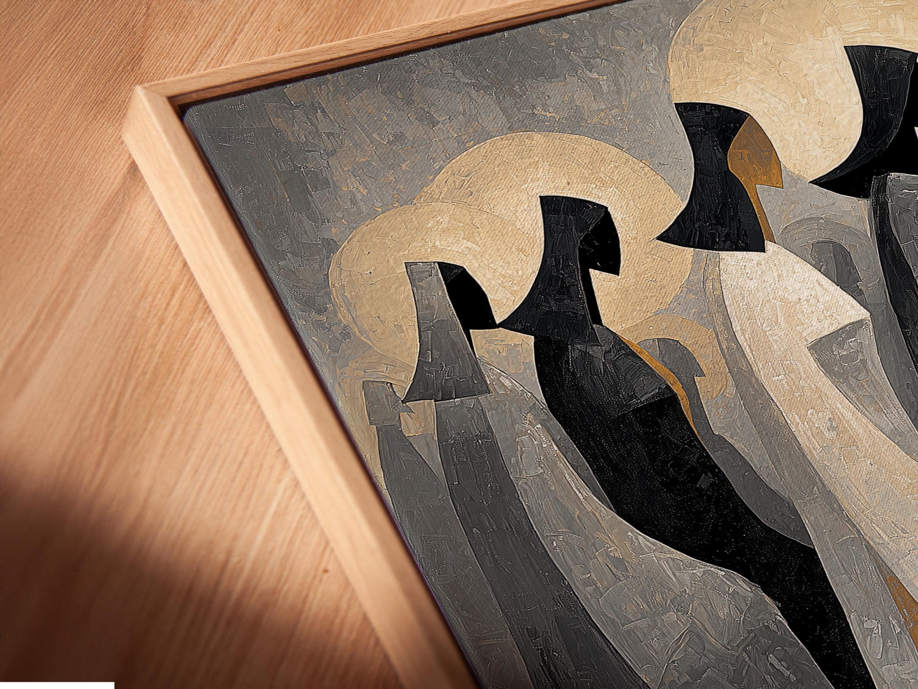 Framed artwork displayed on a neutral background with hooded figures and gold moon discs