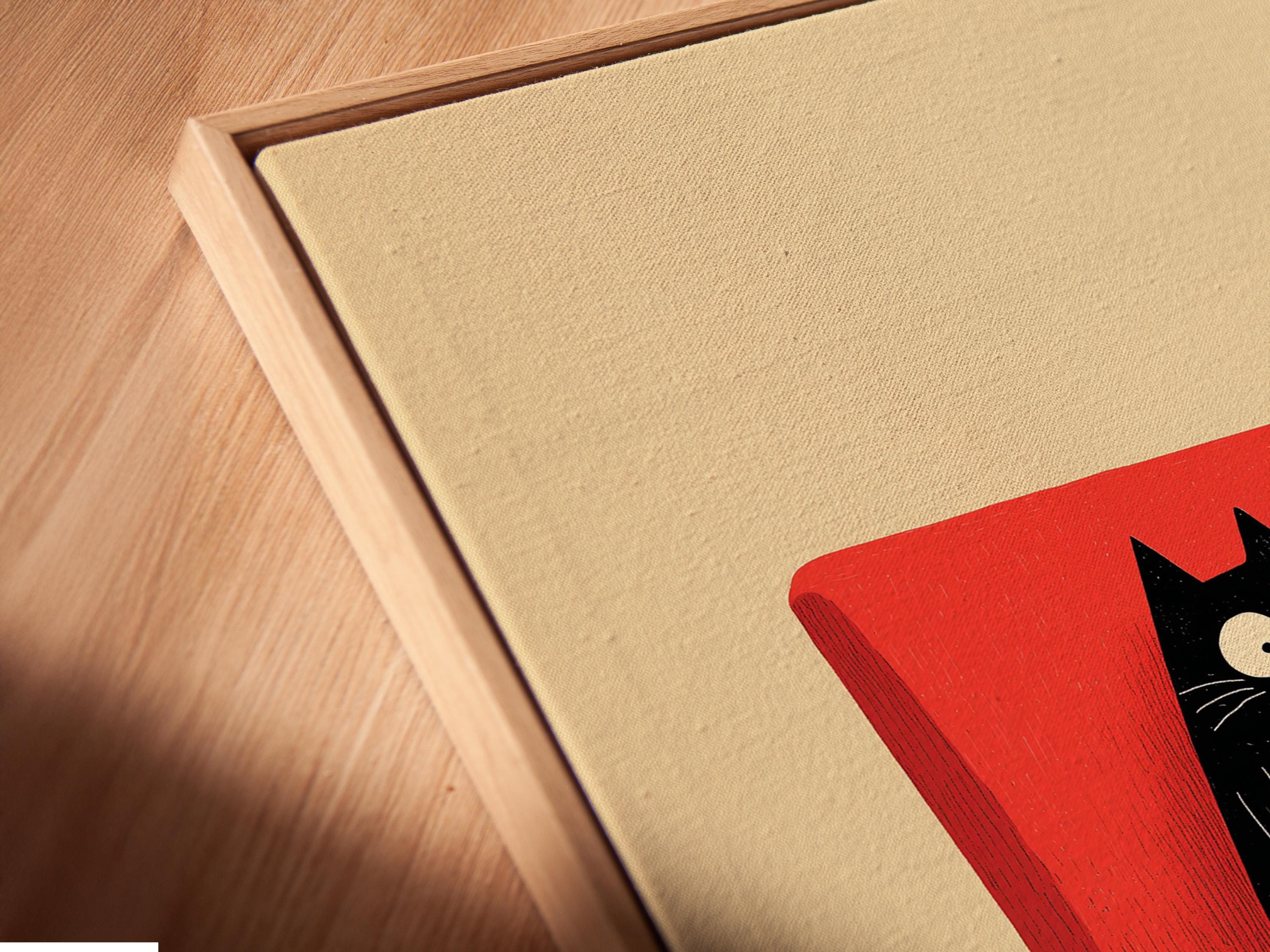 Illustrated black cat reading an orange book while seated in a red armchair detail view