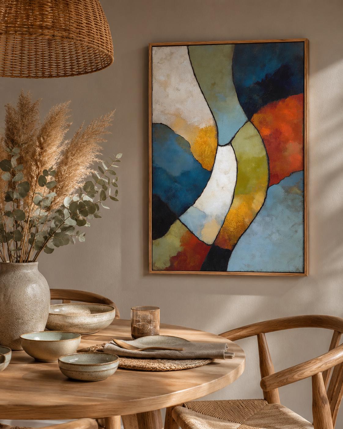 Man sitting on a sofa in a room, with an abstract geometric artwork on the wall