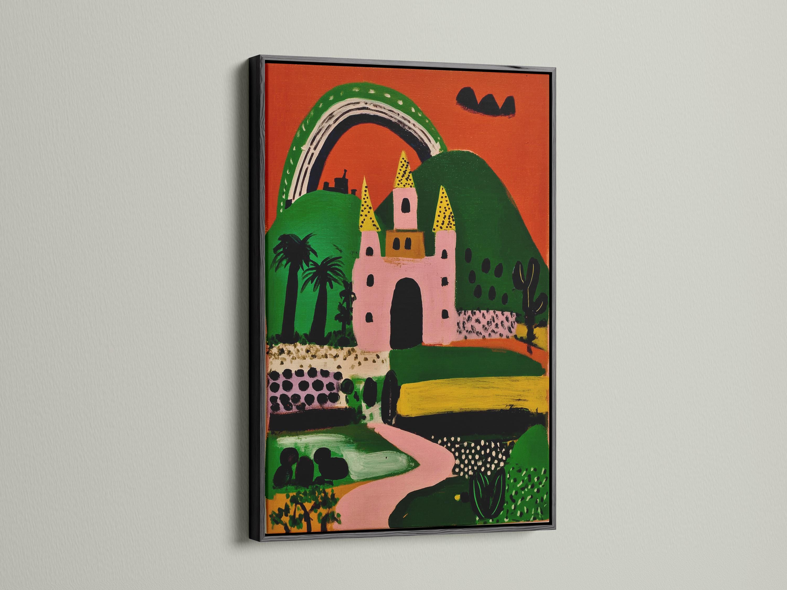 Whimsical pink and green castle with a rainbow arch and yellow tower shapes detail view