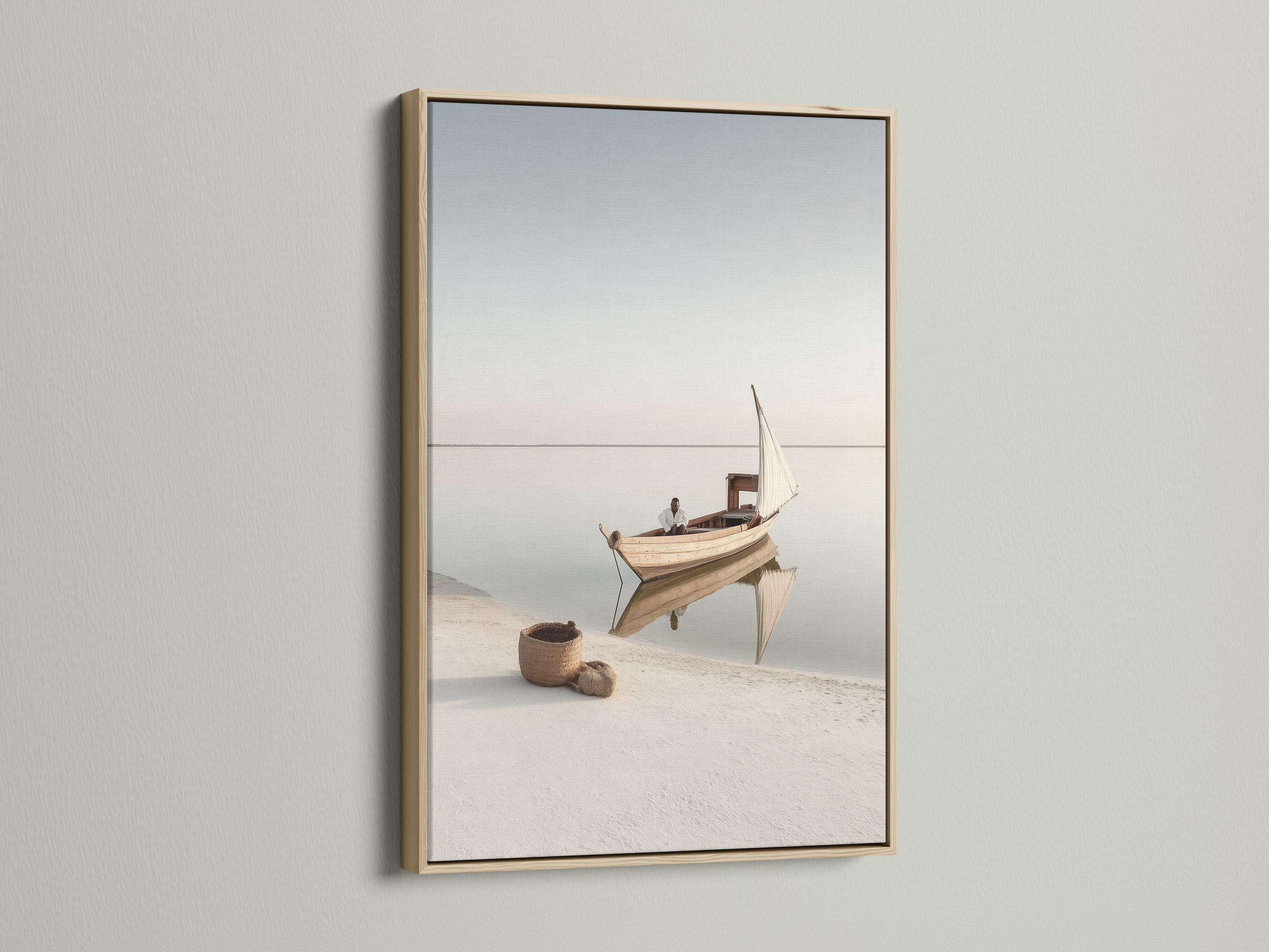 Neutral sailboat seascape with a pale sail on calm water and a hazy horizon detail view