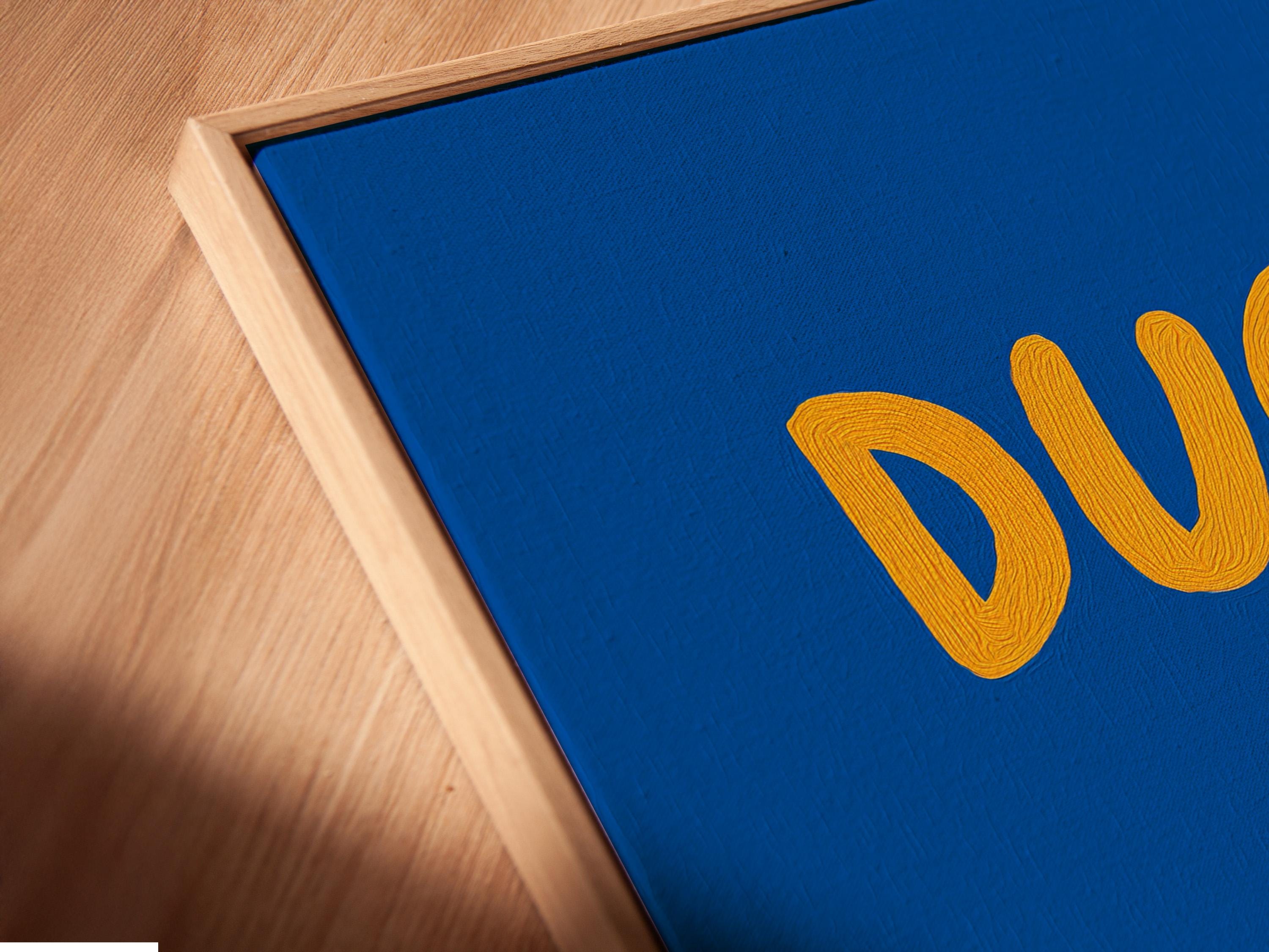 Room mockup showing blue framed duck artwork with orange “DUCK” text