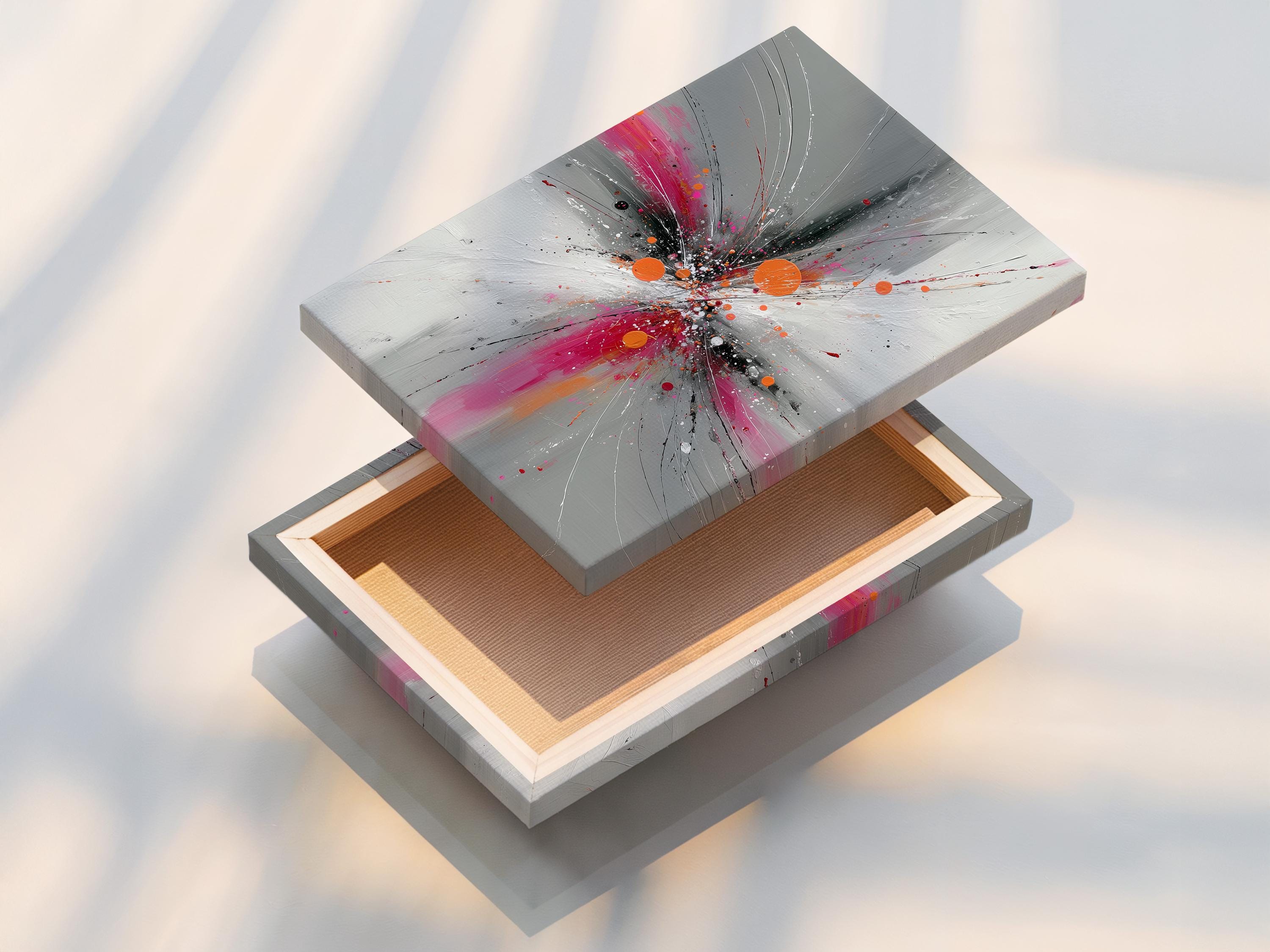 Abstract burst artwork with radiating grey and white lines, pink splashes and orange circular accents detail view
