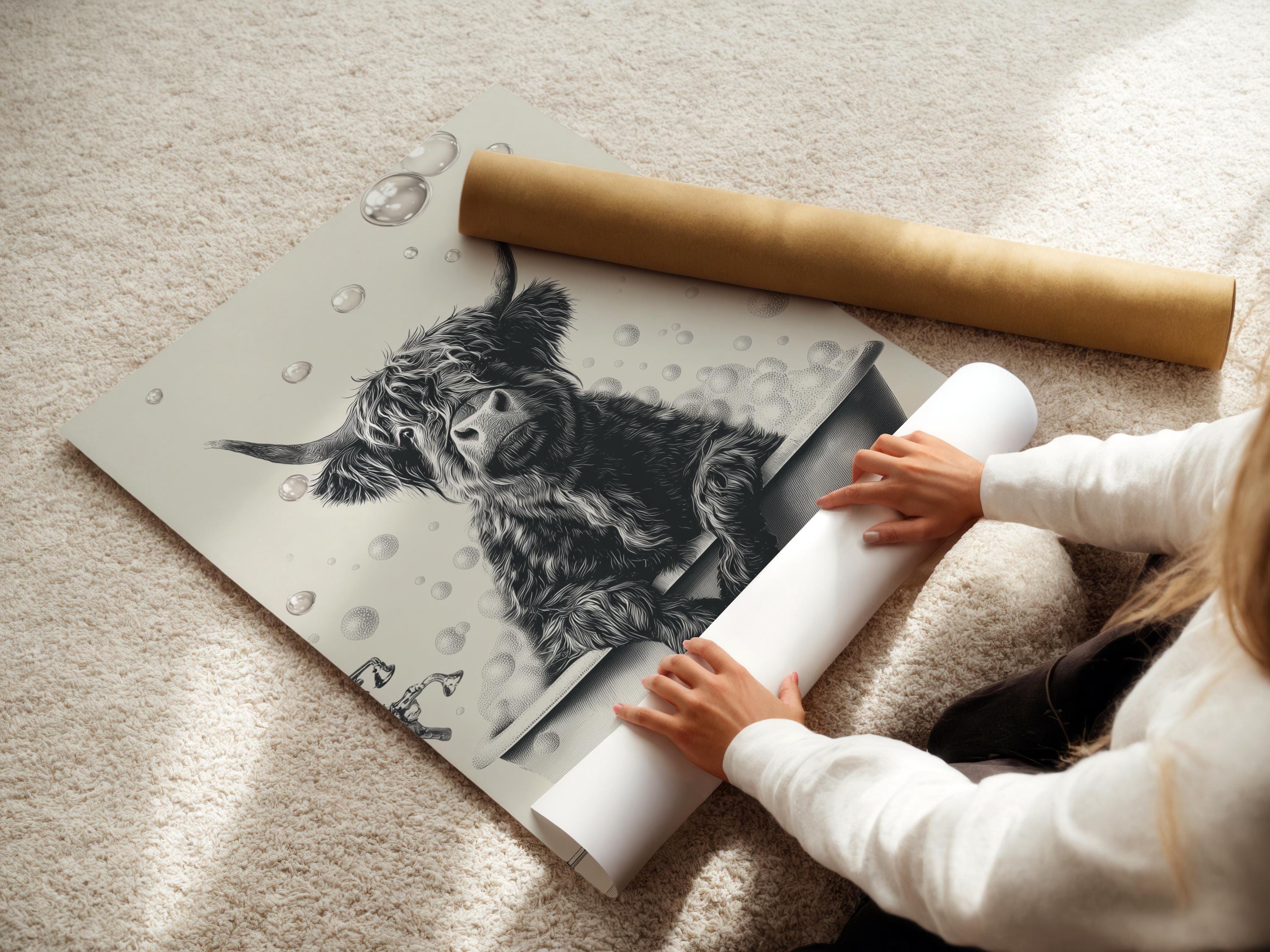 Woman holding a mug standing beside a framed monochrome highland cow bathtub artwork