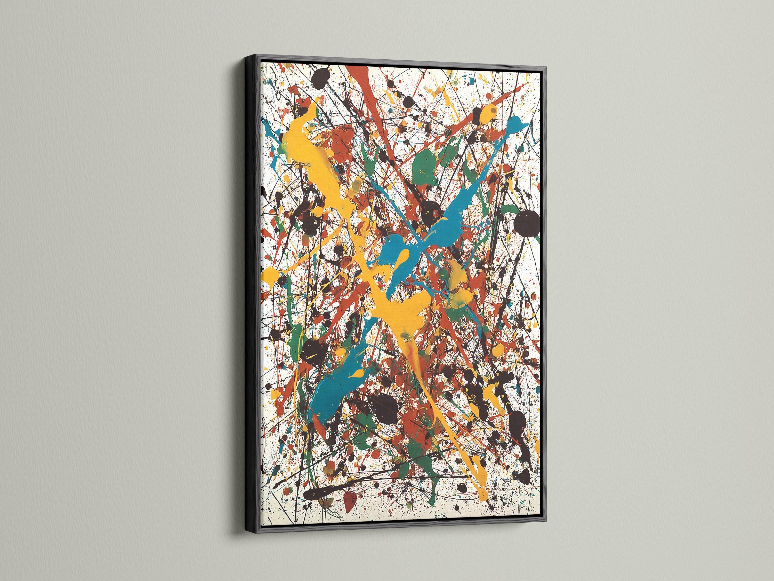 Abstract splatter artwork with layered blue, teal, yellow, red and green shapes on a white background detail view