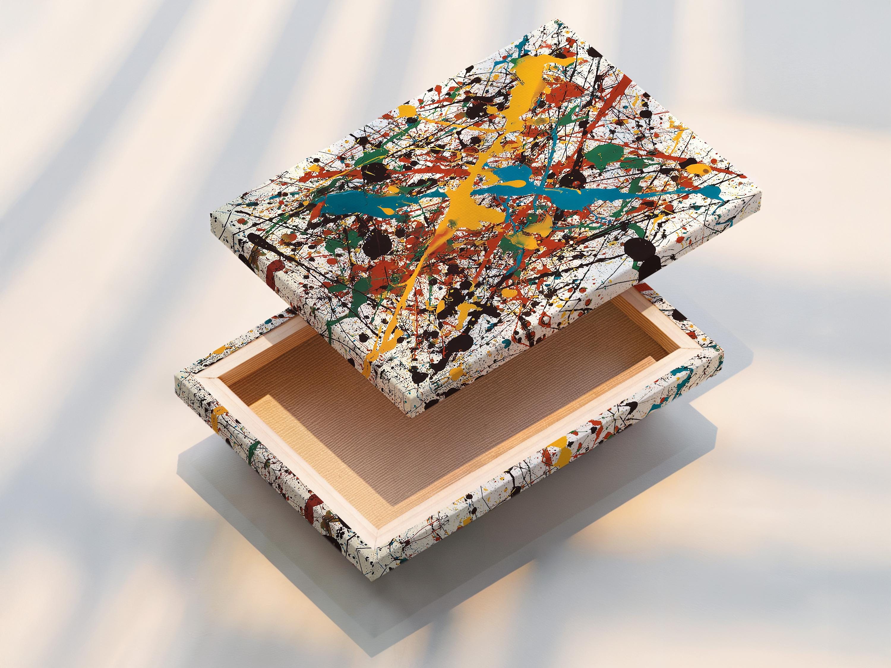 Abstract splatter artwork with layered blue, teal, yellow, red and green shapes on a white background detail view