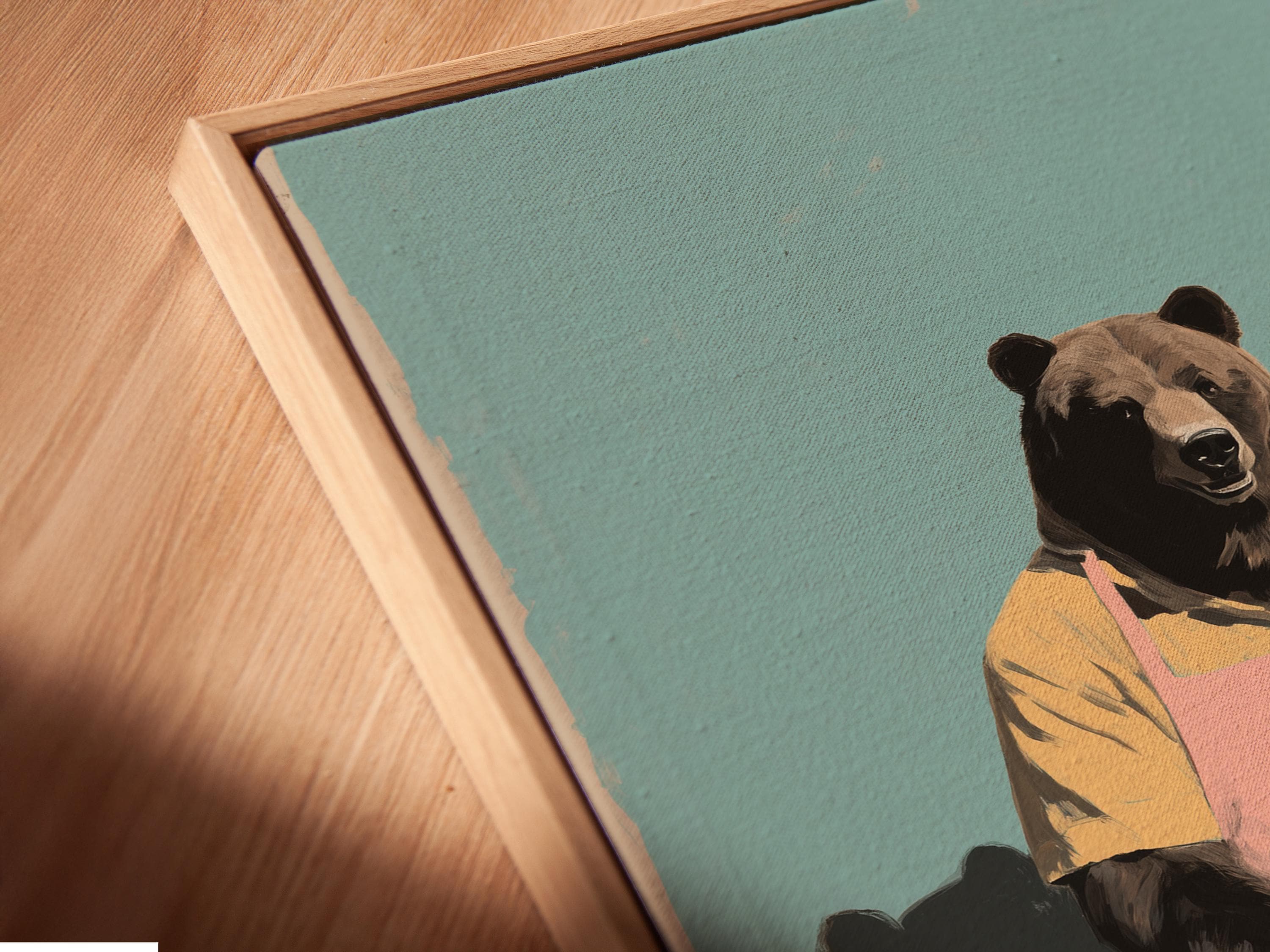Bear chef illustration wearing a pink apron behind a counter with bread on a teal background detail view