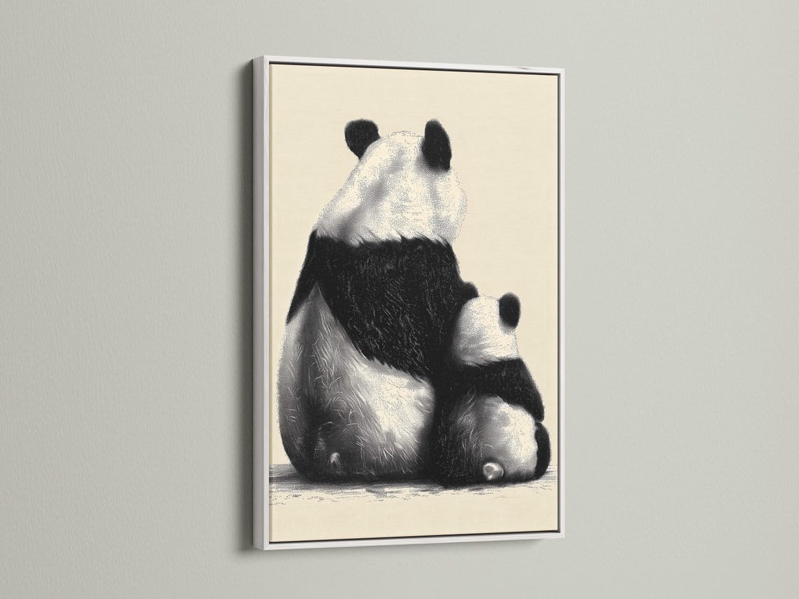 Wall mockup showing a framed panda portrait artwork in black and beige