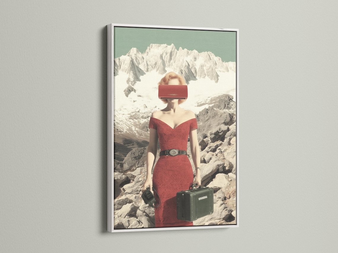 Surreal woman in a red dress standing in a snowy mountain landscape with luggage detail view