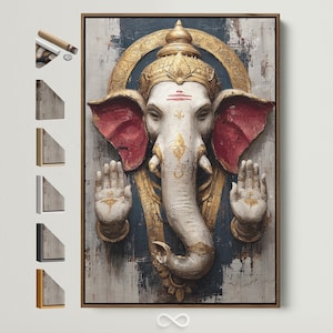 May include: A framed canvas print depicting Ganesha, a Hindu deity. The artwork shows a white elephant head with red ears, a golden crown, and raised hands. The background has a textured, distressed appearance with blue and grey tones. The frame is brown.