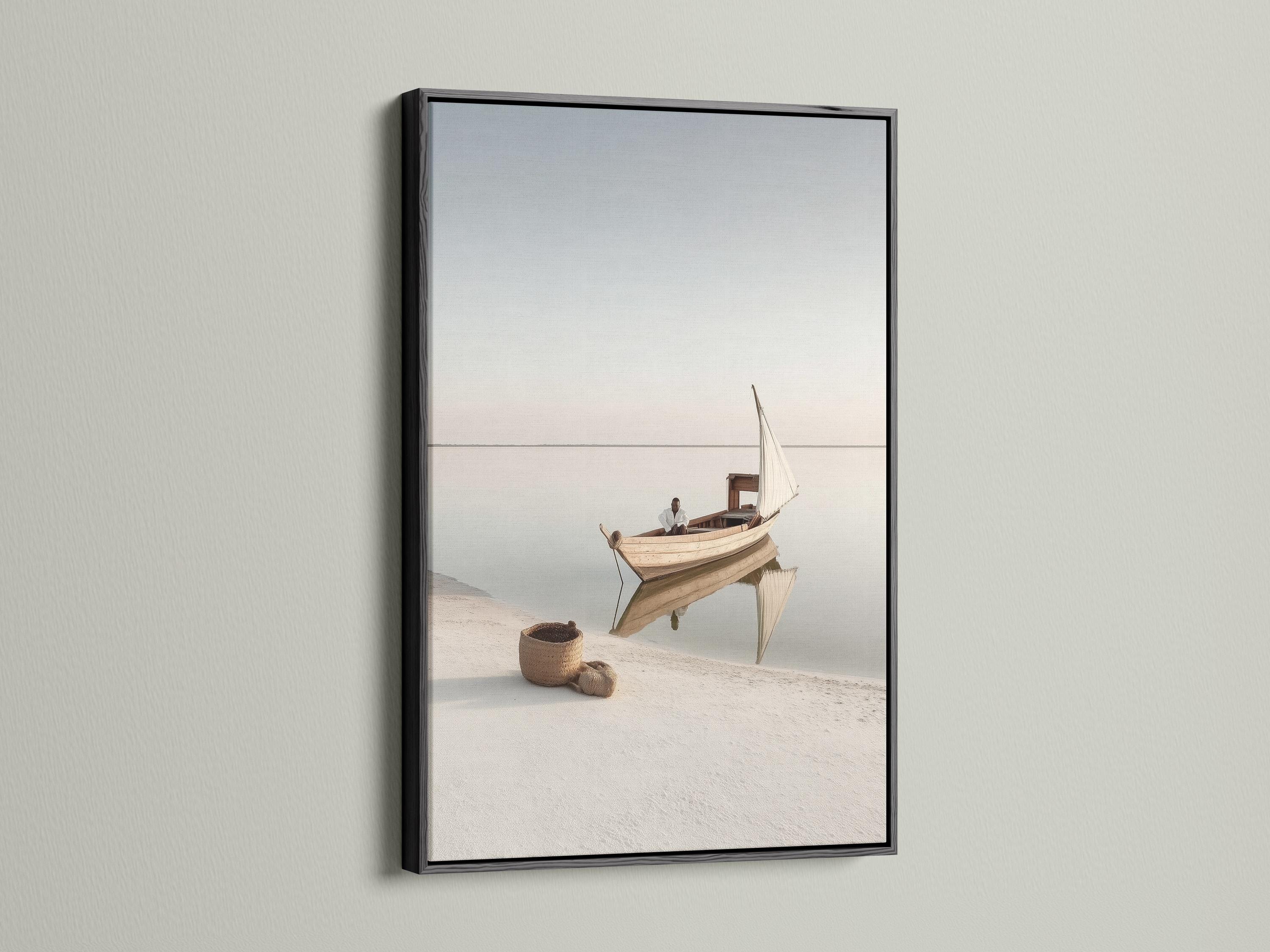 Neutral sailboat seascape with a pale sail on calm water and a hazy horizon detail view