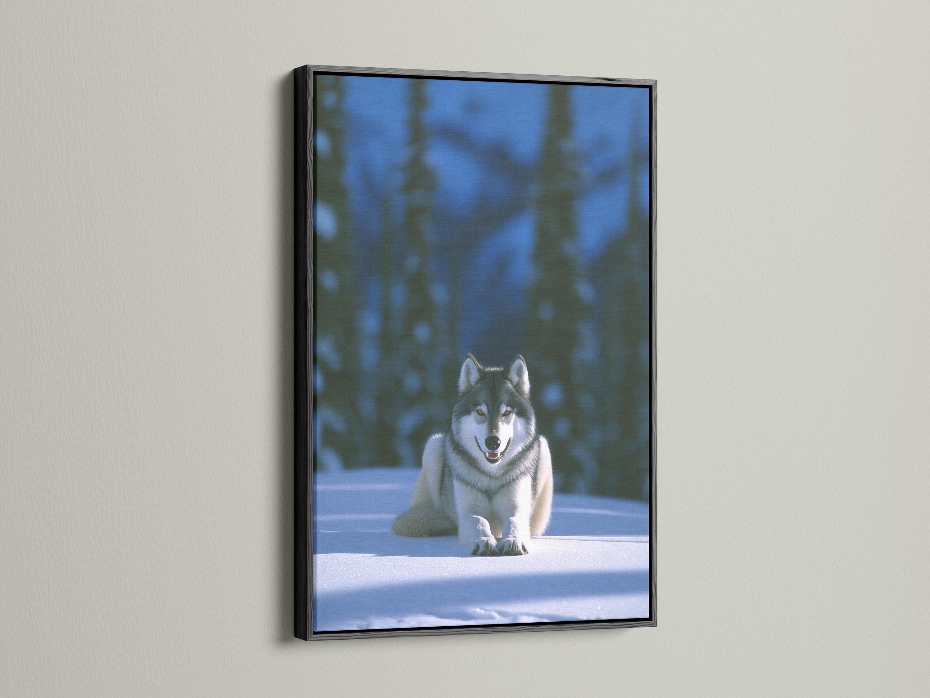 Grey wolf reclining on snow in a softly blurred winter forest detail view
